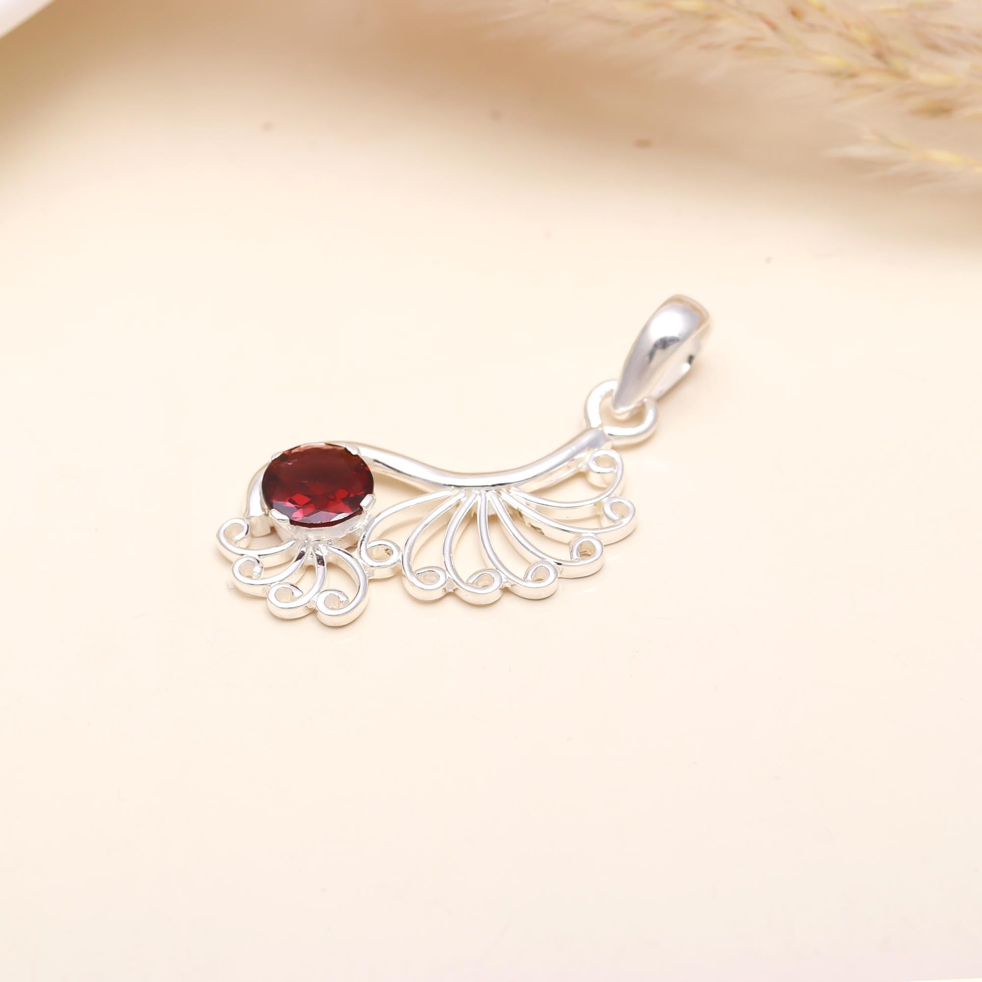 The Peacock Flame: Garnet Filigree Scroll Silver Pendant
