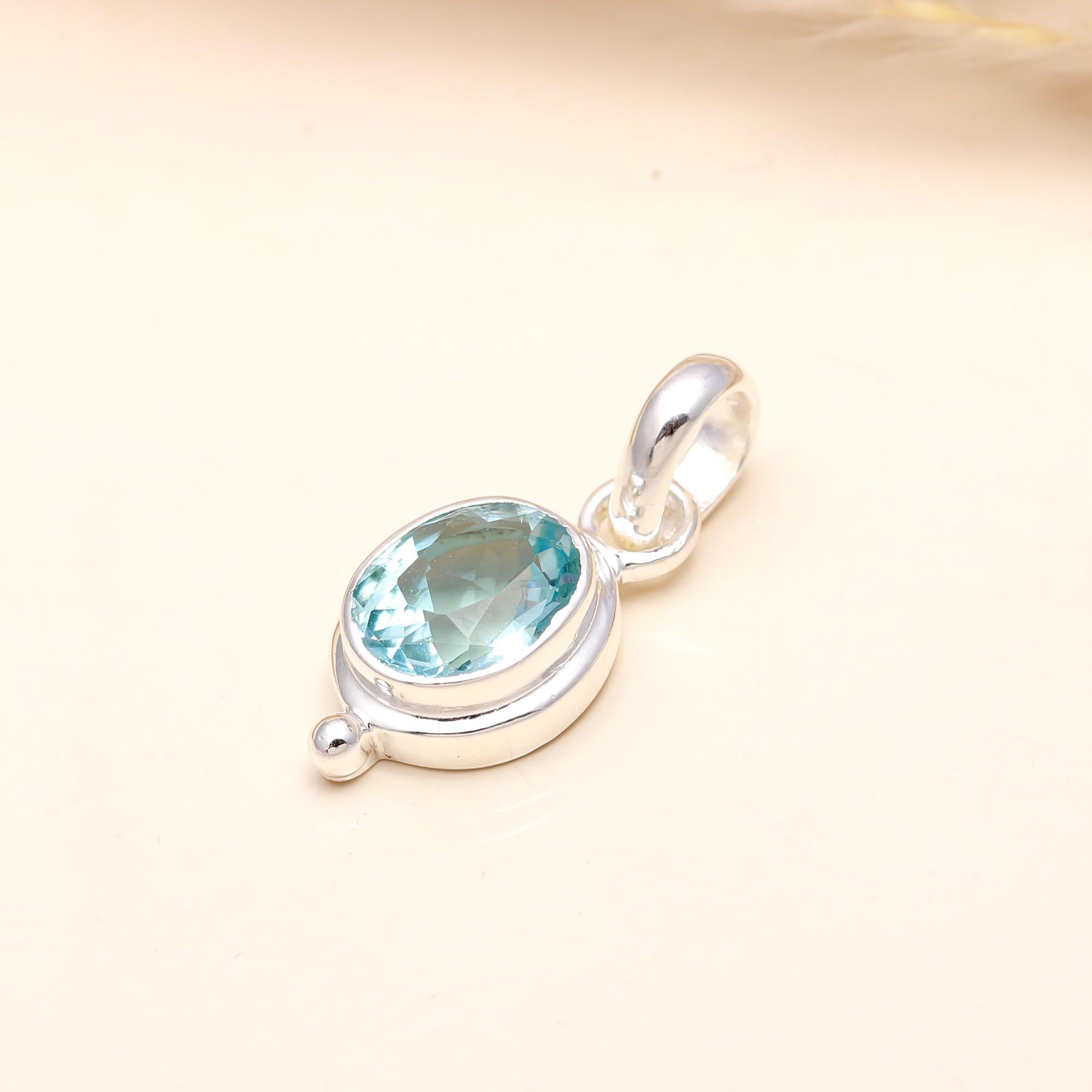 The Sky Drop: Oval Blue Topaz Dainty Bezel Silver Pendant