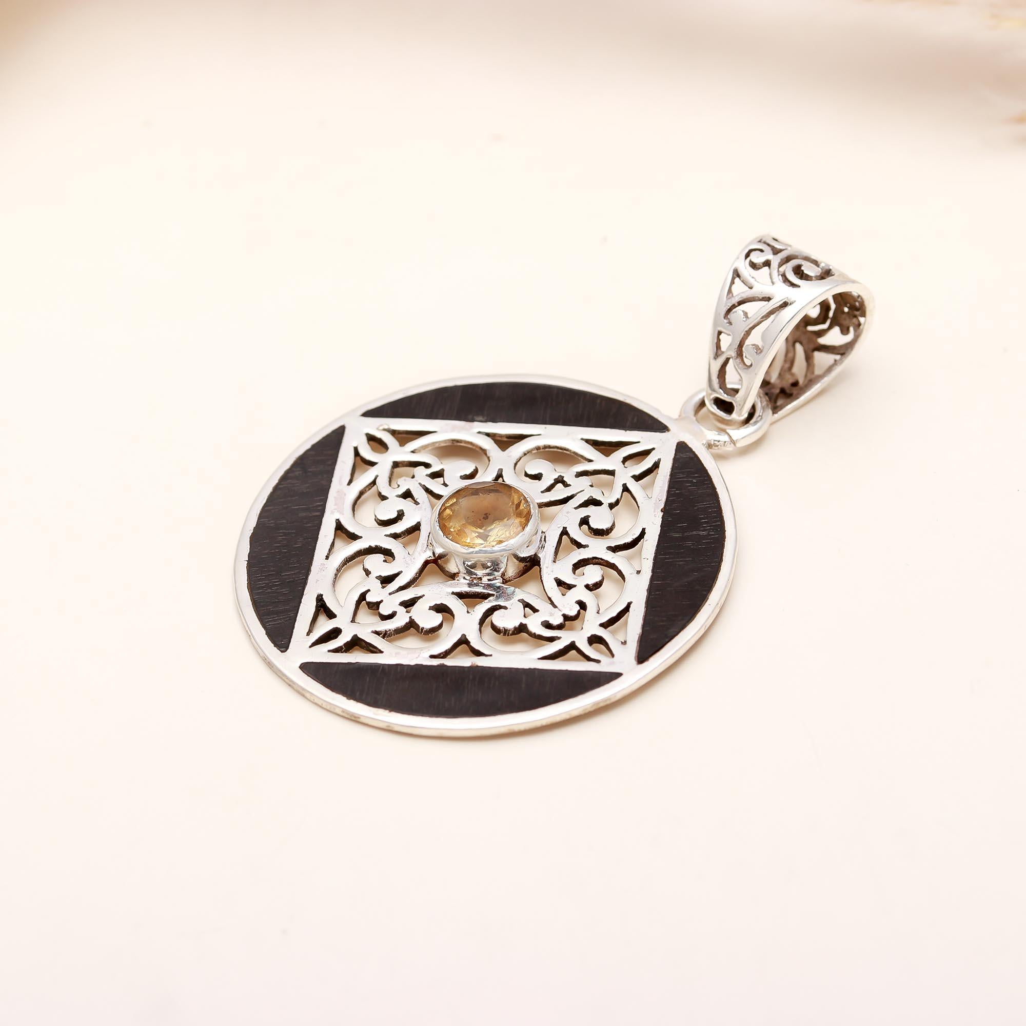 The Golden Compass: Black Ebony Wood Filigree Pendant