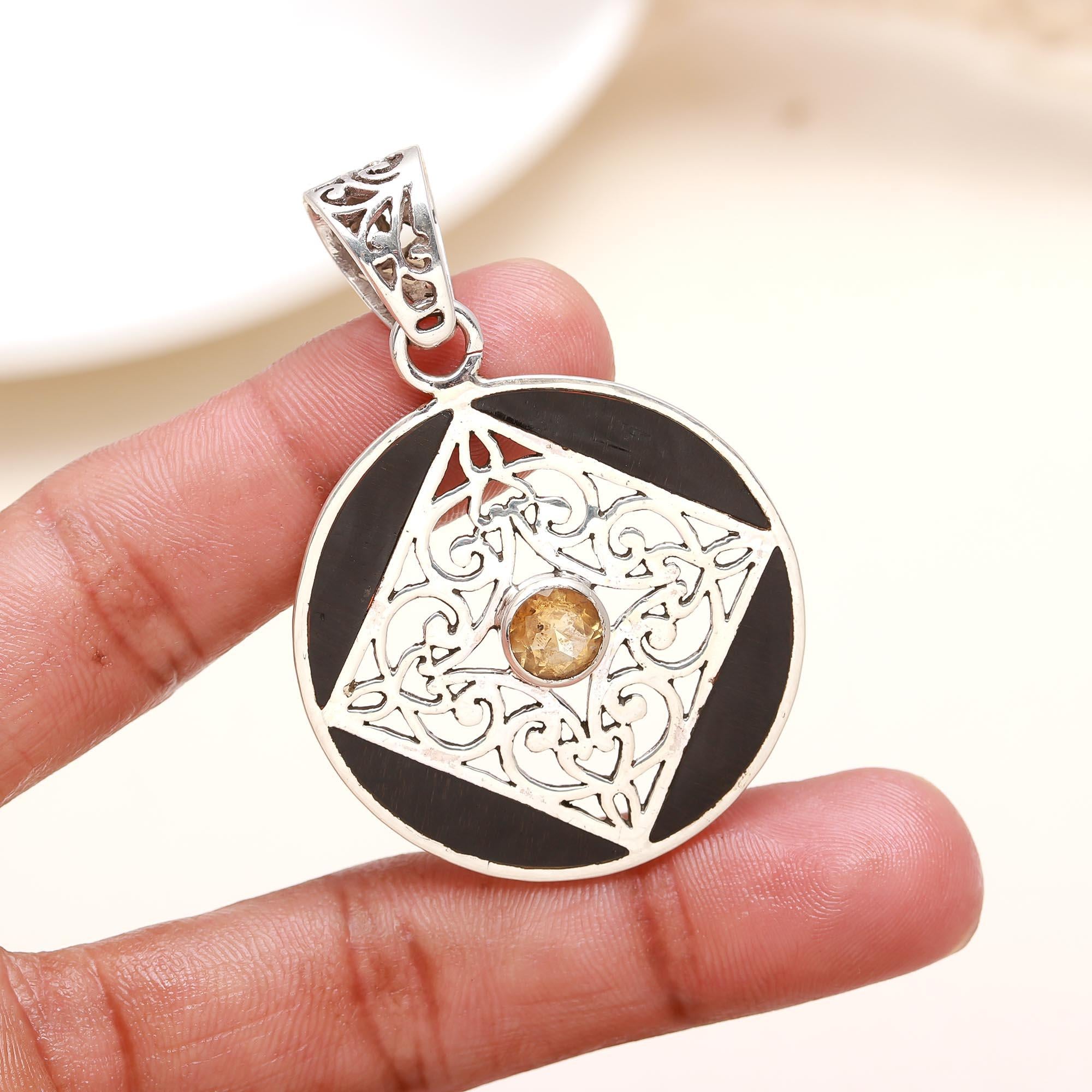 The Golden Compass: Black Ebony Wood Filigree Pendant