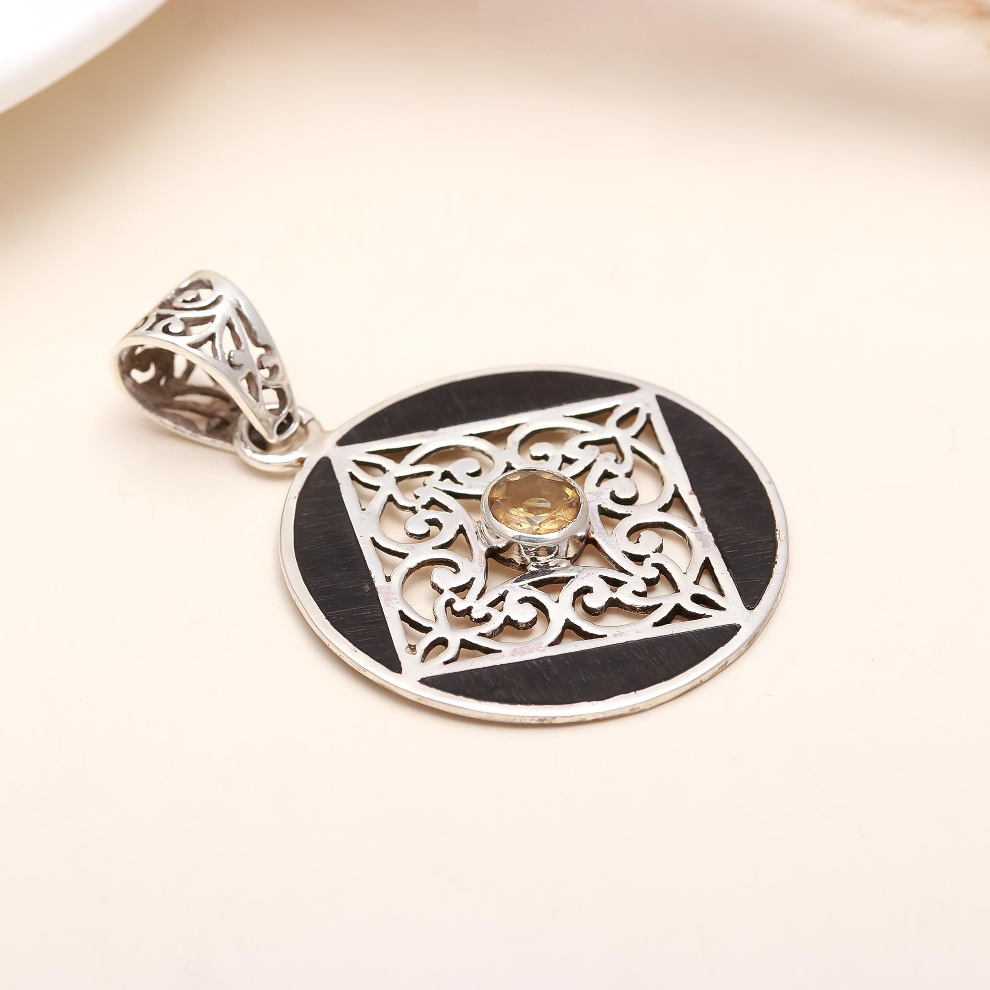 The Golden Compass: Black Ebony Wood Filigree Pendant