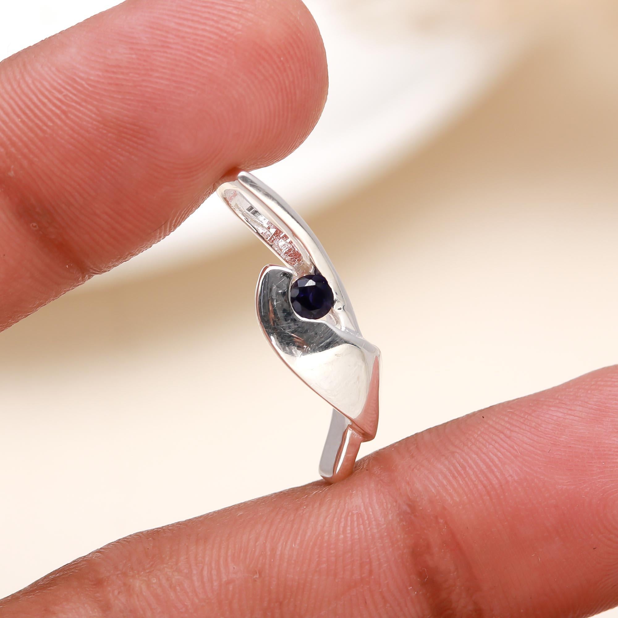 The Sculptural Fold: Silver & Sapphire Pendant