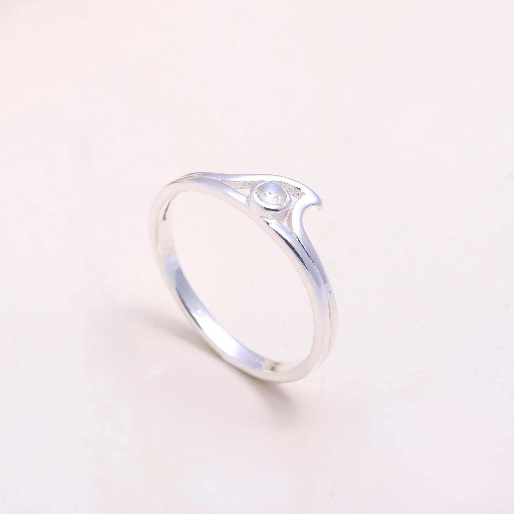 The Ocean Embrace: Moonstone Wave Ring