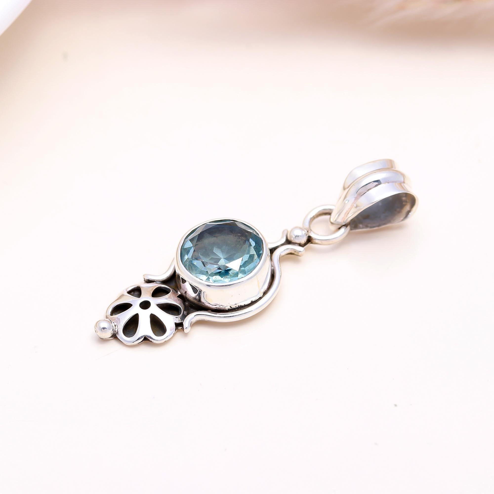 The Petal Cascade: Blue Topaz Articulated Pendant