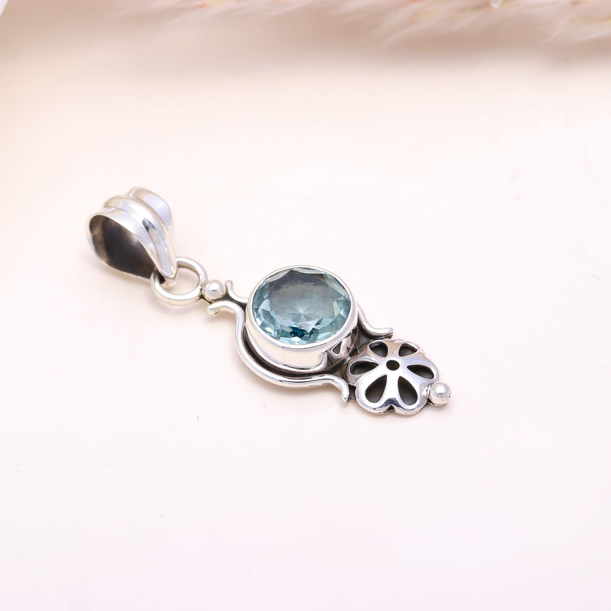 The Petal Cascade: Blue Topaz Articulated Pendant