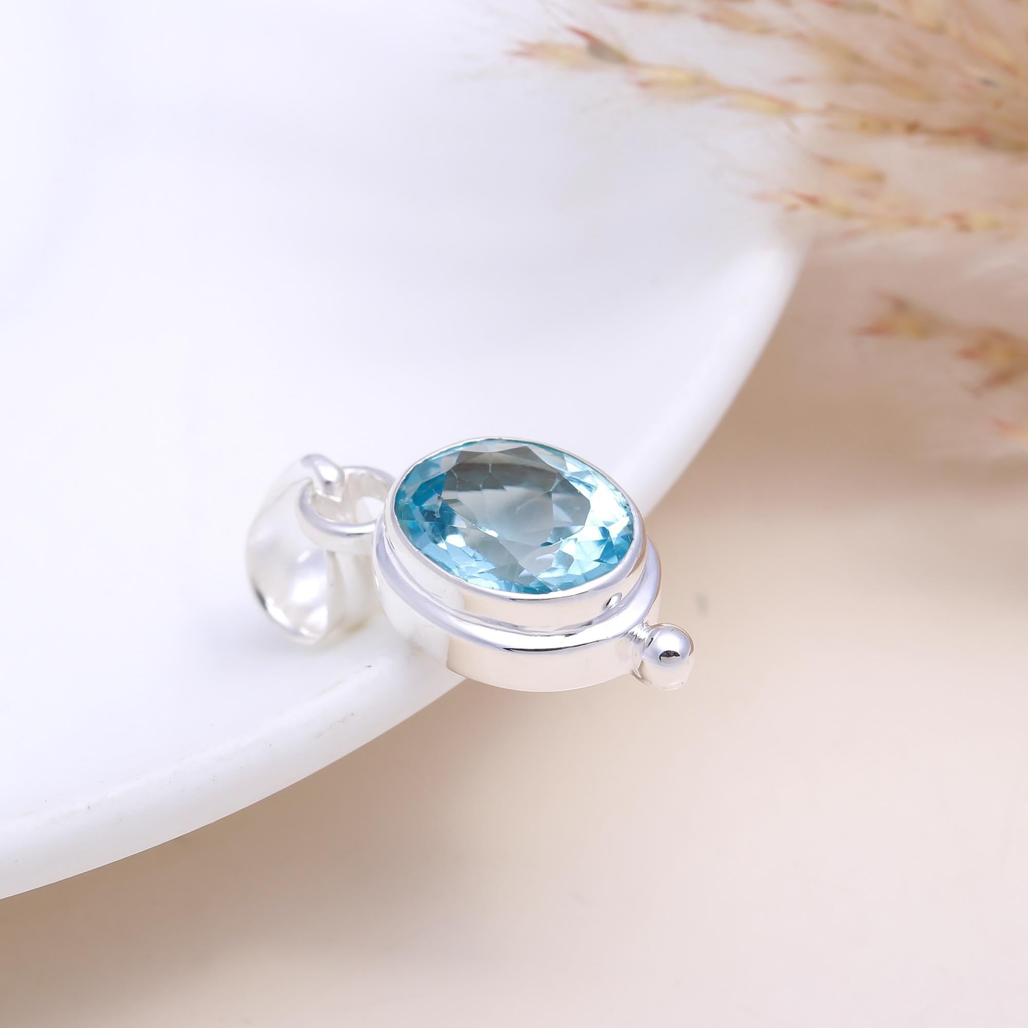 The Serene Oval: Blue Topaz East-West Pendant