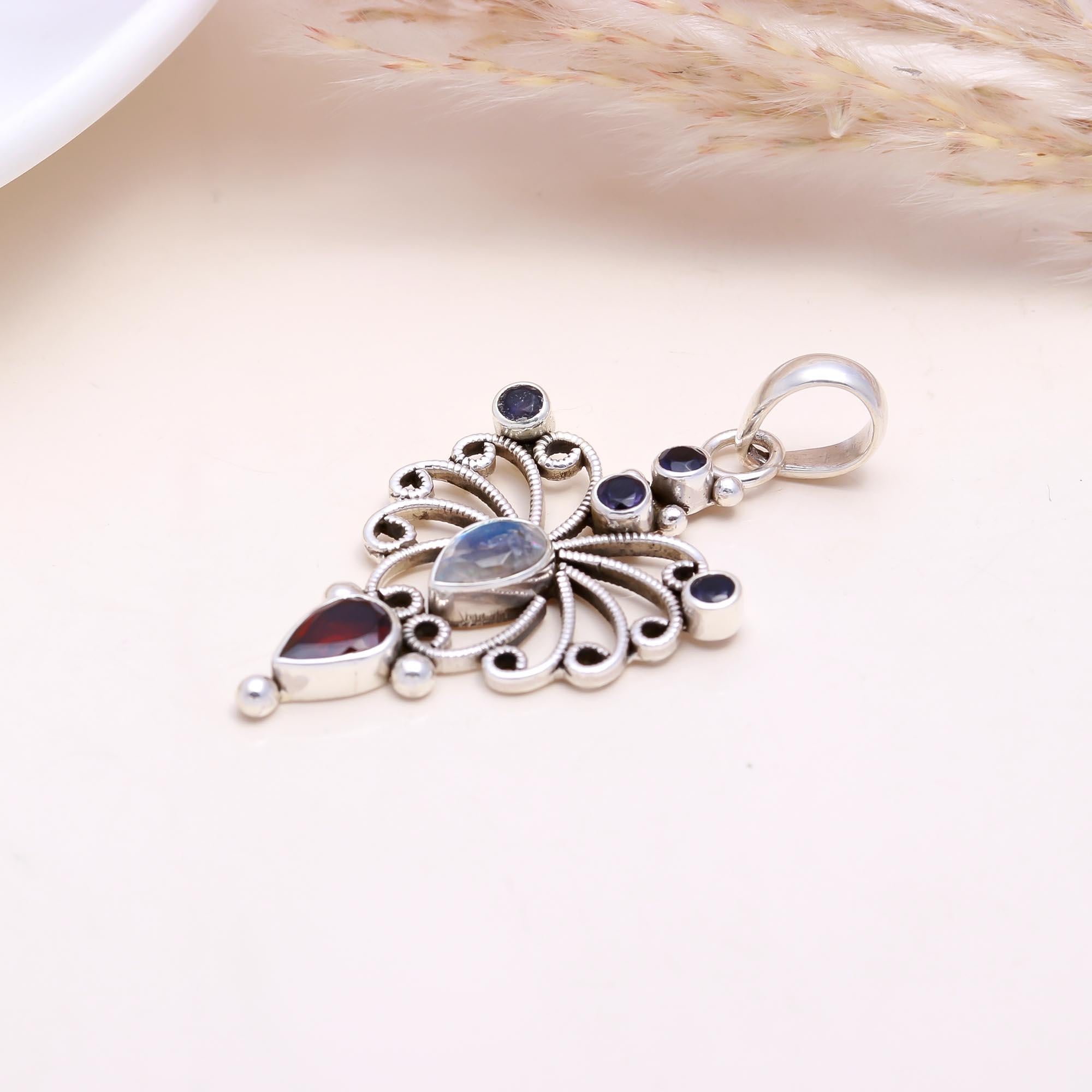 The Celestial Butterfly: Moonstone & Garnet Pendant