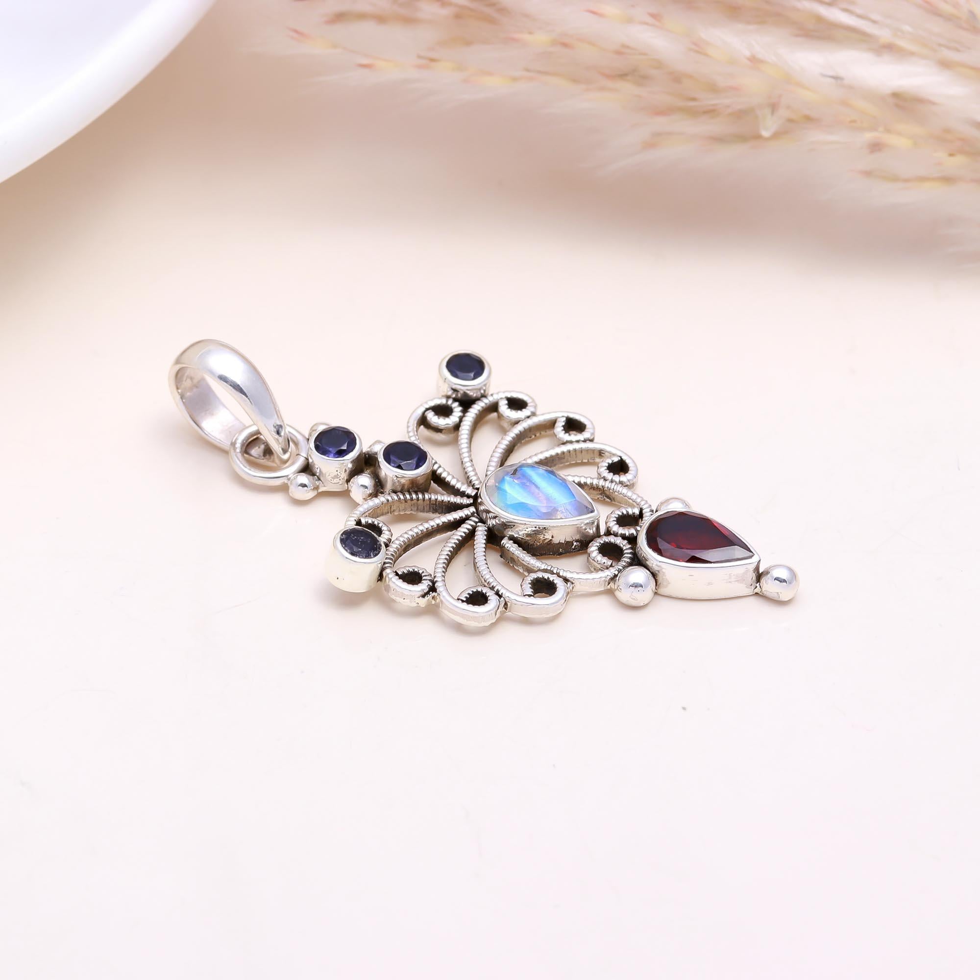 The Celestial Butterfly: Moonstone & Garnet Pendant