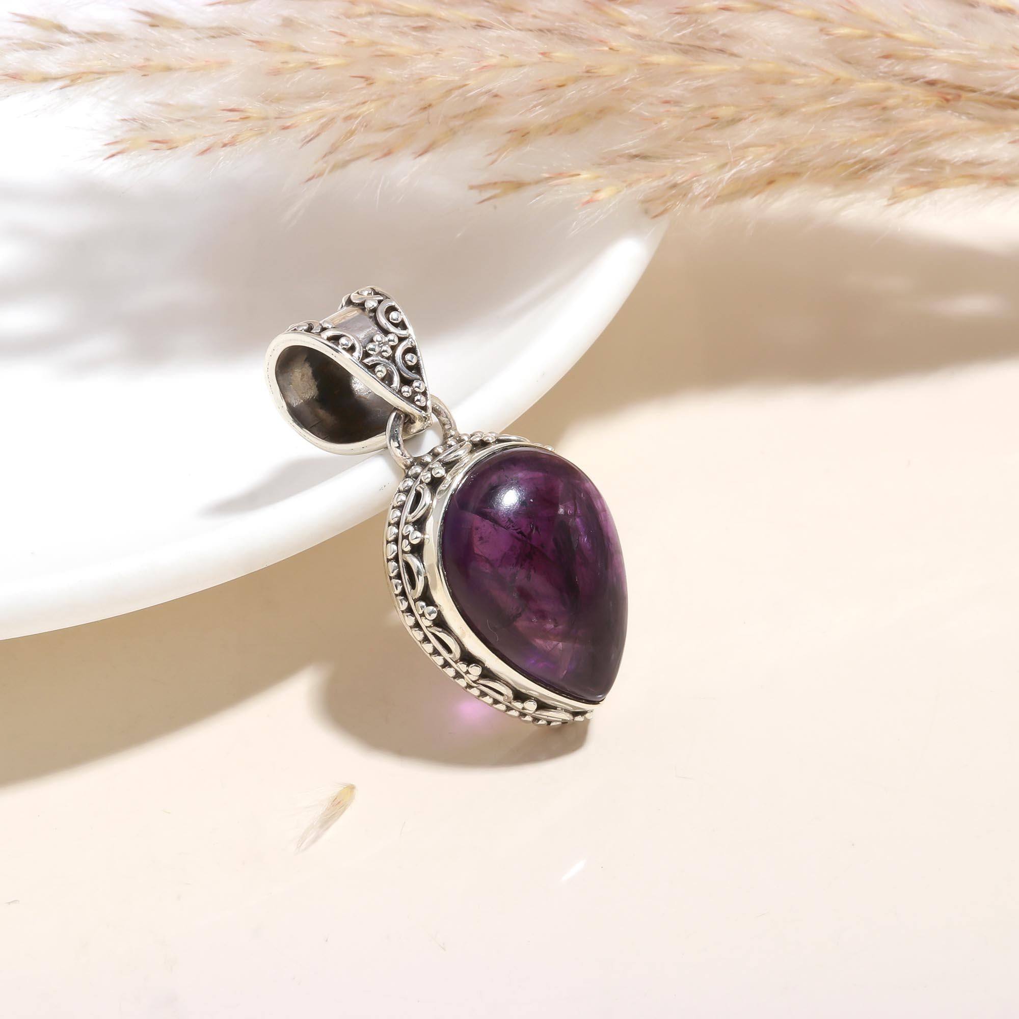 The Balinese Amethyst: Intricate Teardrop Silver Pendant