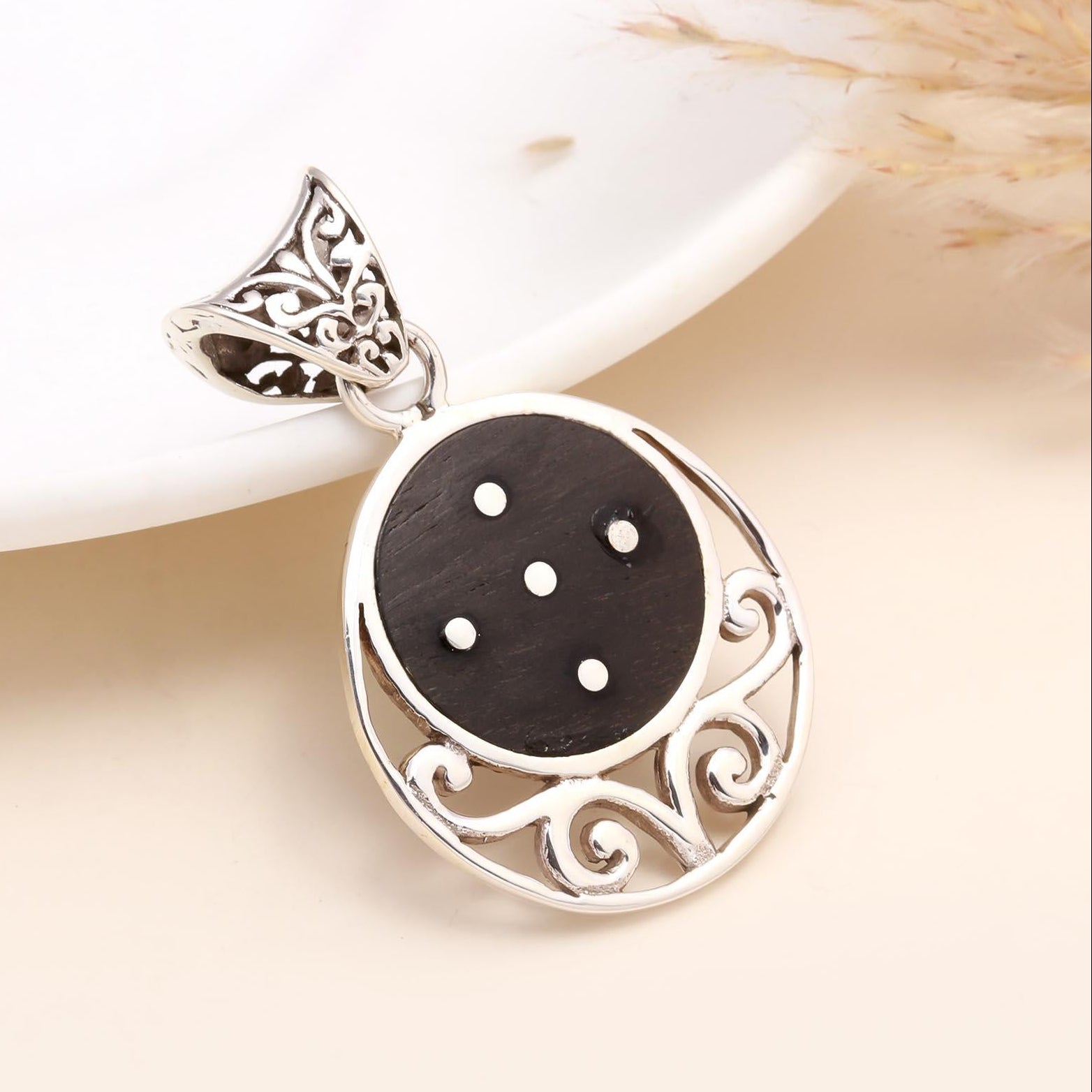 A 925 sterling silver pendant with a natural wood grain inlay, displayed against a neutral background.