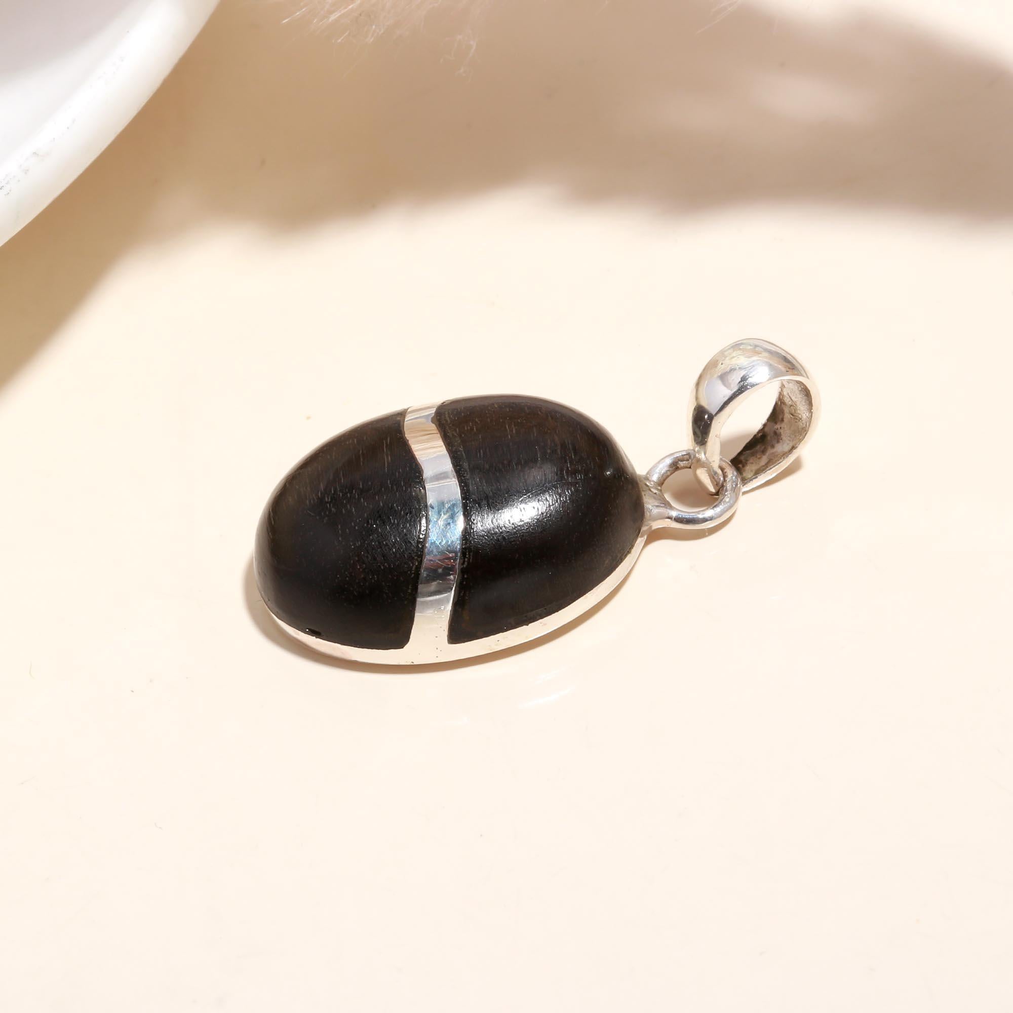 The Ebony Orb: Minimalist Silver Charm