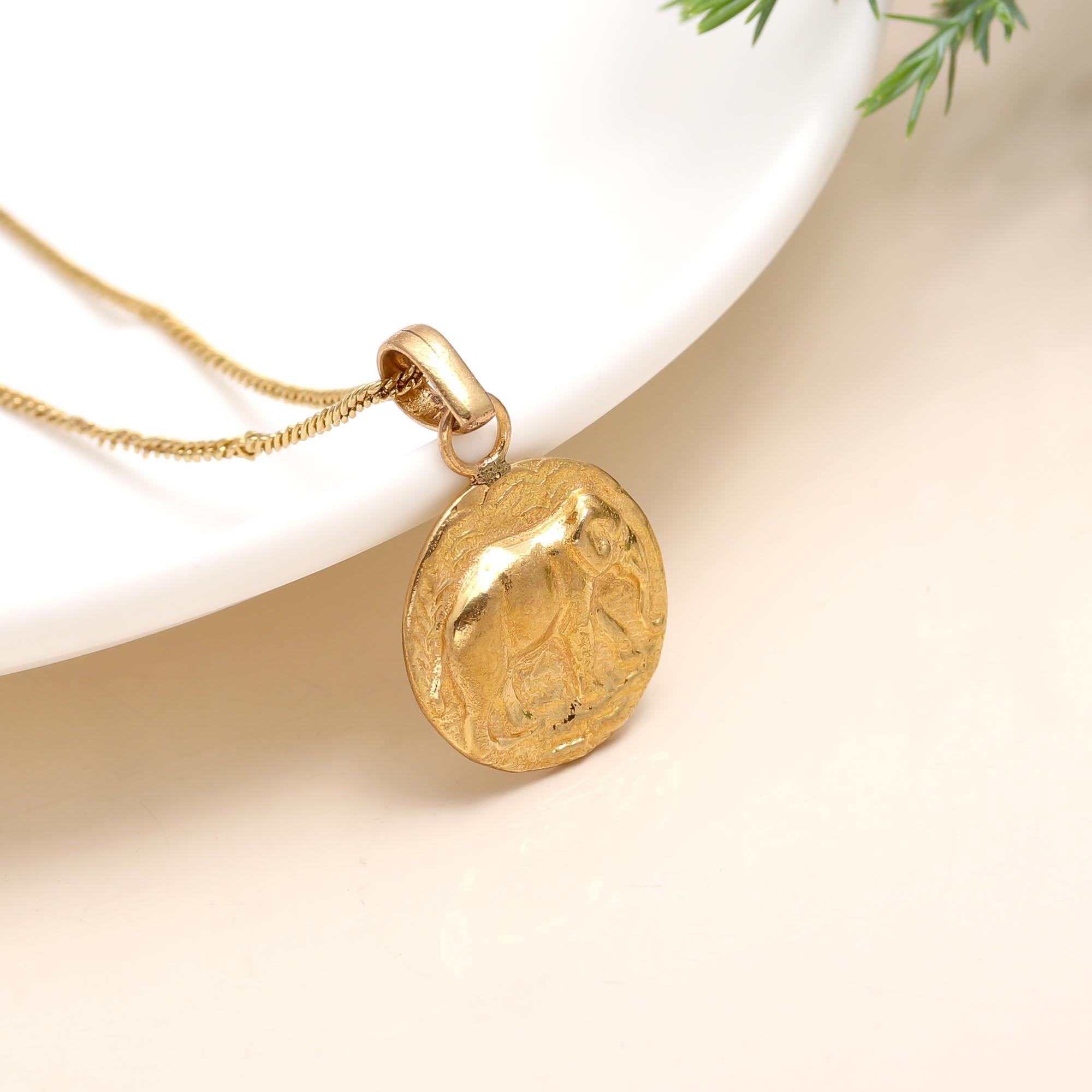 The Golden Guardian: Embossed Elephant Medallion