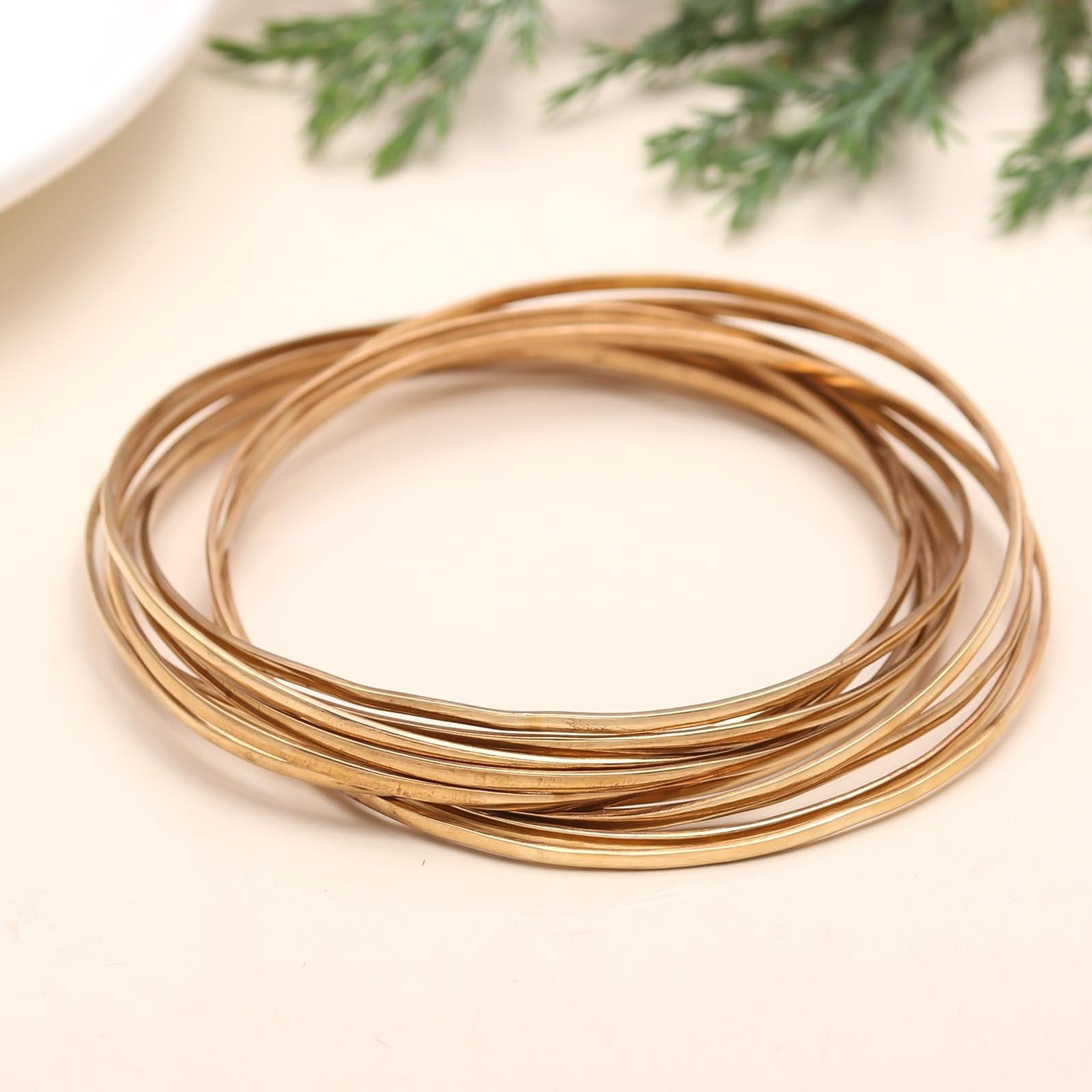 The Golden Cascade: Multi-Strand Gold Bangle Set