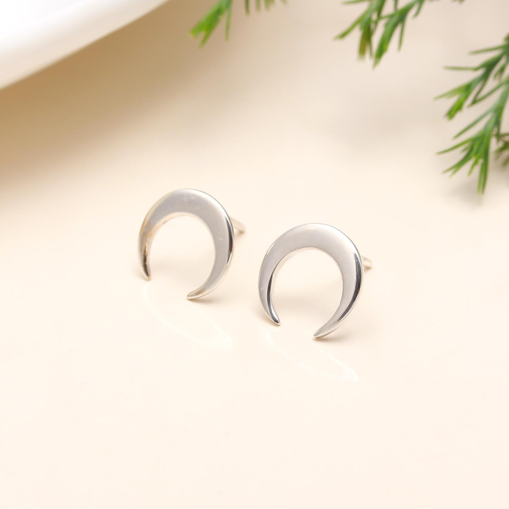 The Lunar Silhouette: Silver Crescent Moon Stud Earrings