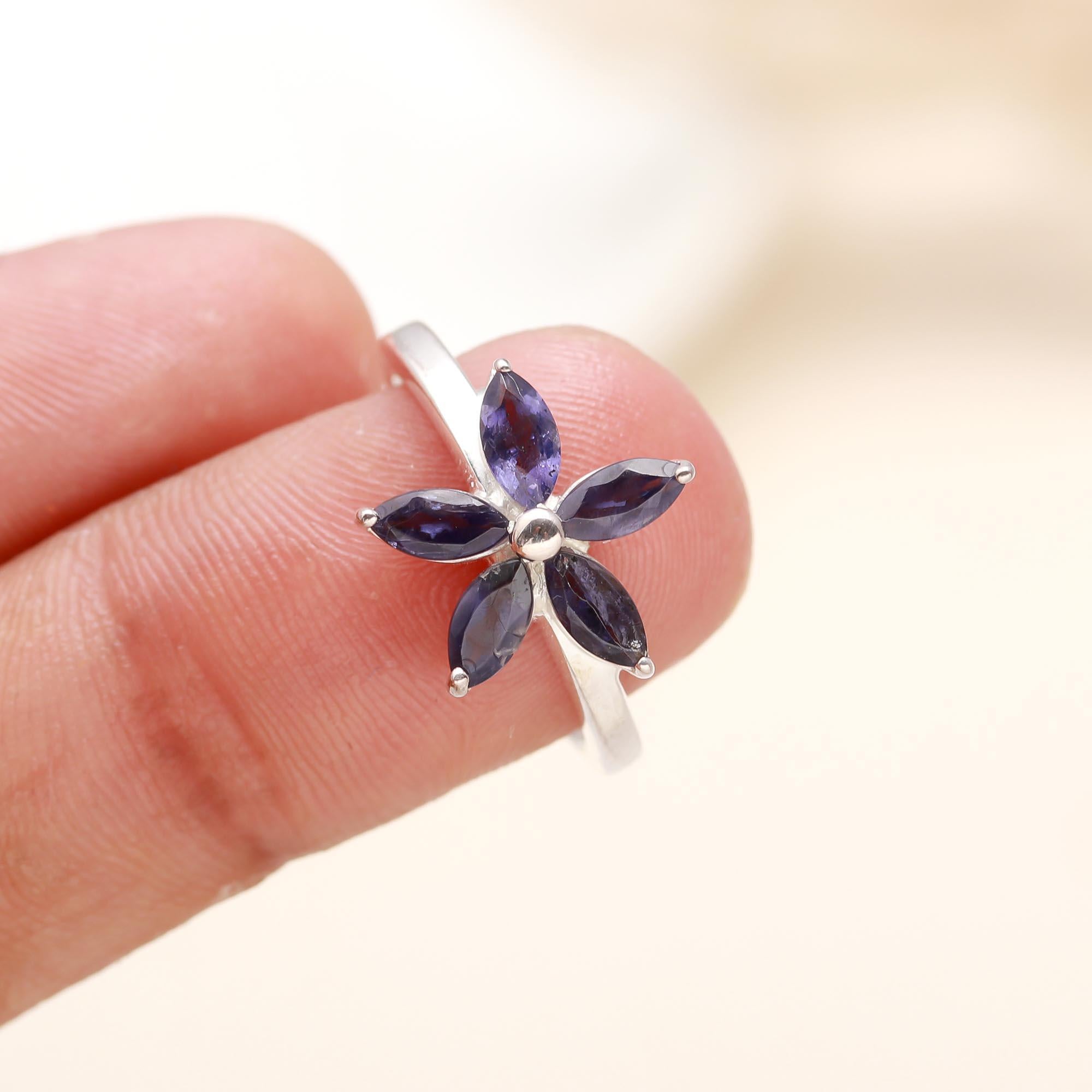 Close-up of sterling silver floral ring with iolite gemstone