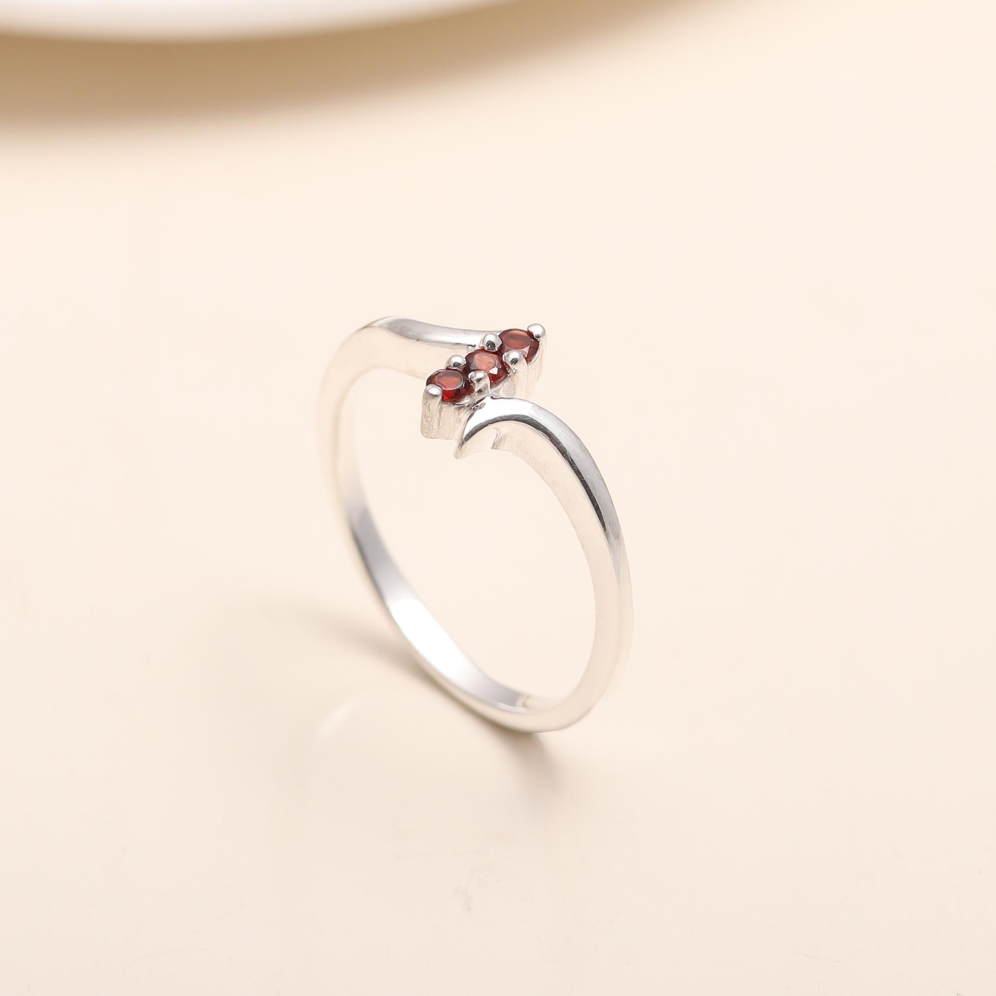 Polished sterling silver garnet ring
