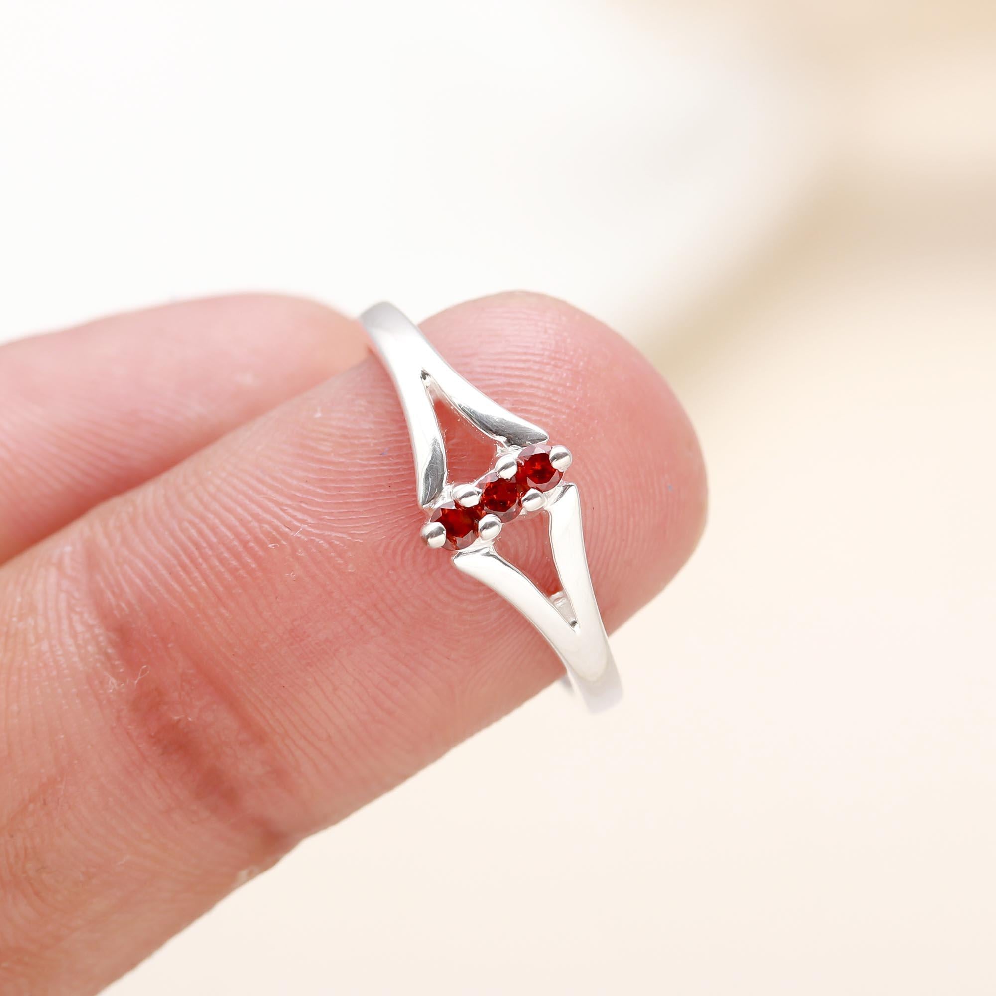 Handcrafted open band silver ring with red garnets