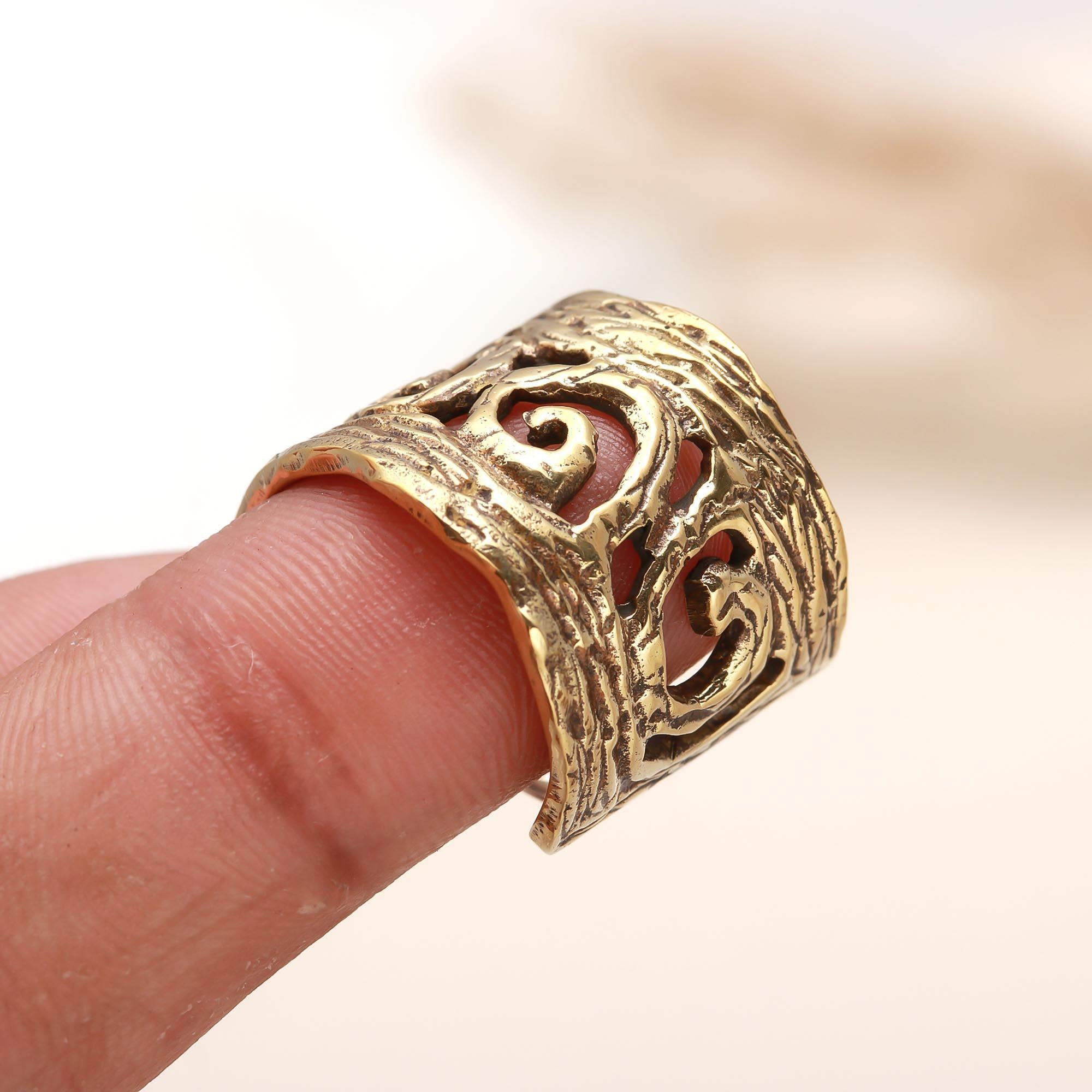 Gold plated swirl design silver ring on finger