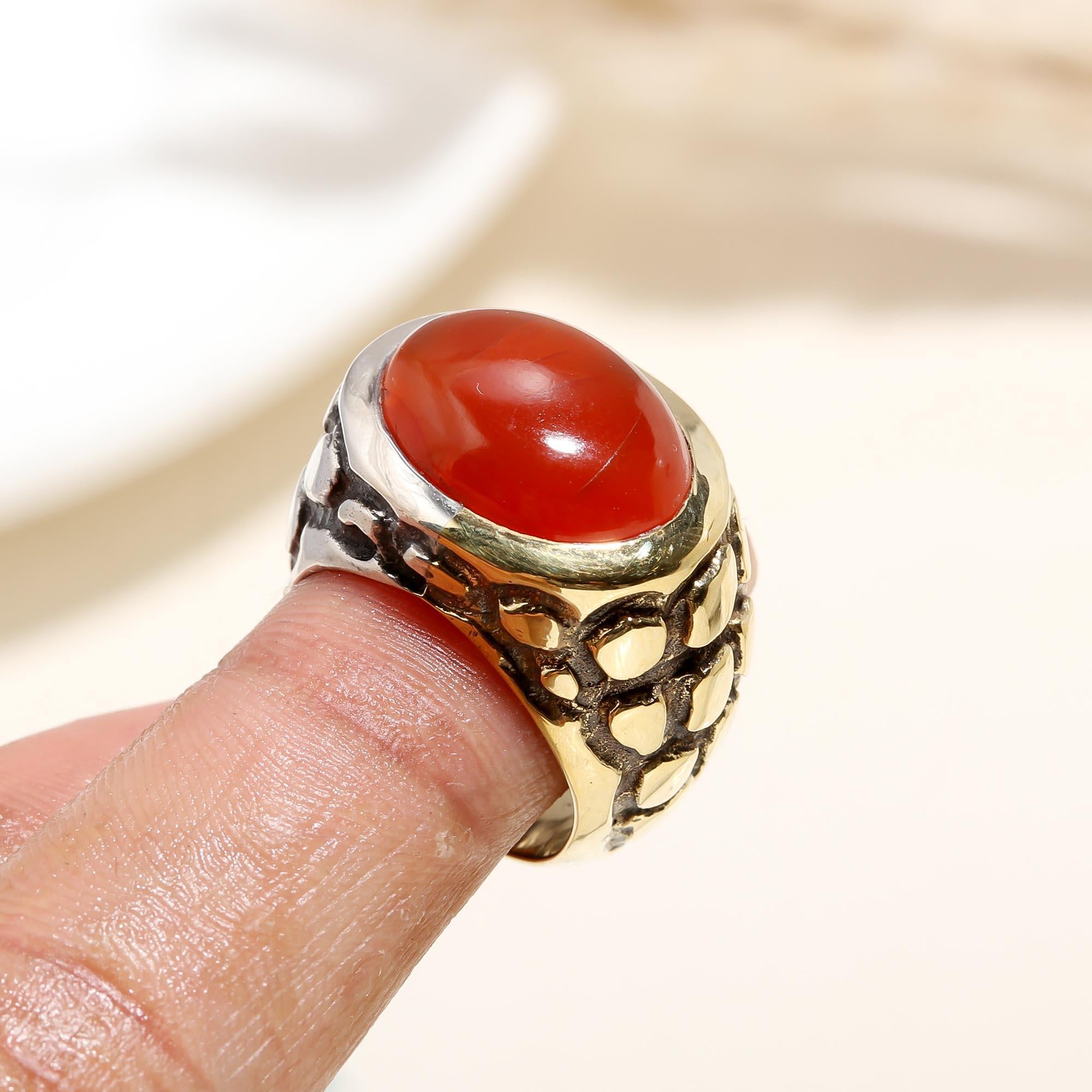 Bold red carnelian silver ring on finger