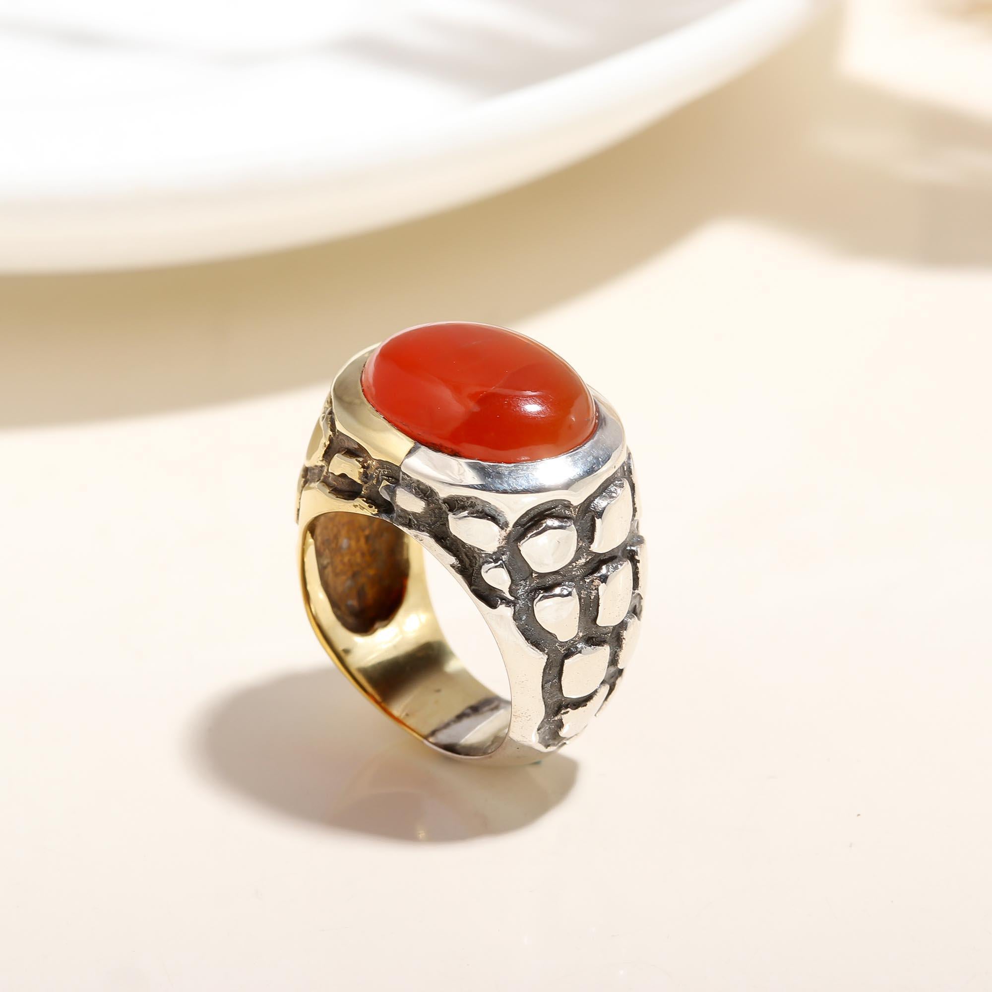 Textured silver band with polished red carnelian gemstone