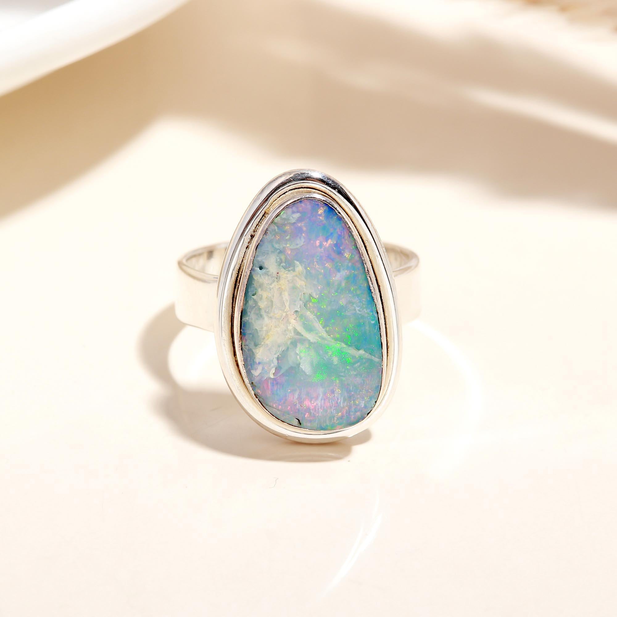 Sterling silver band with oval blue opal gemstone