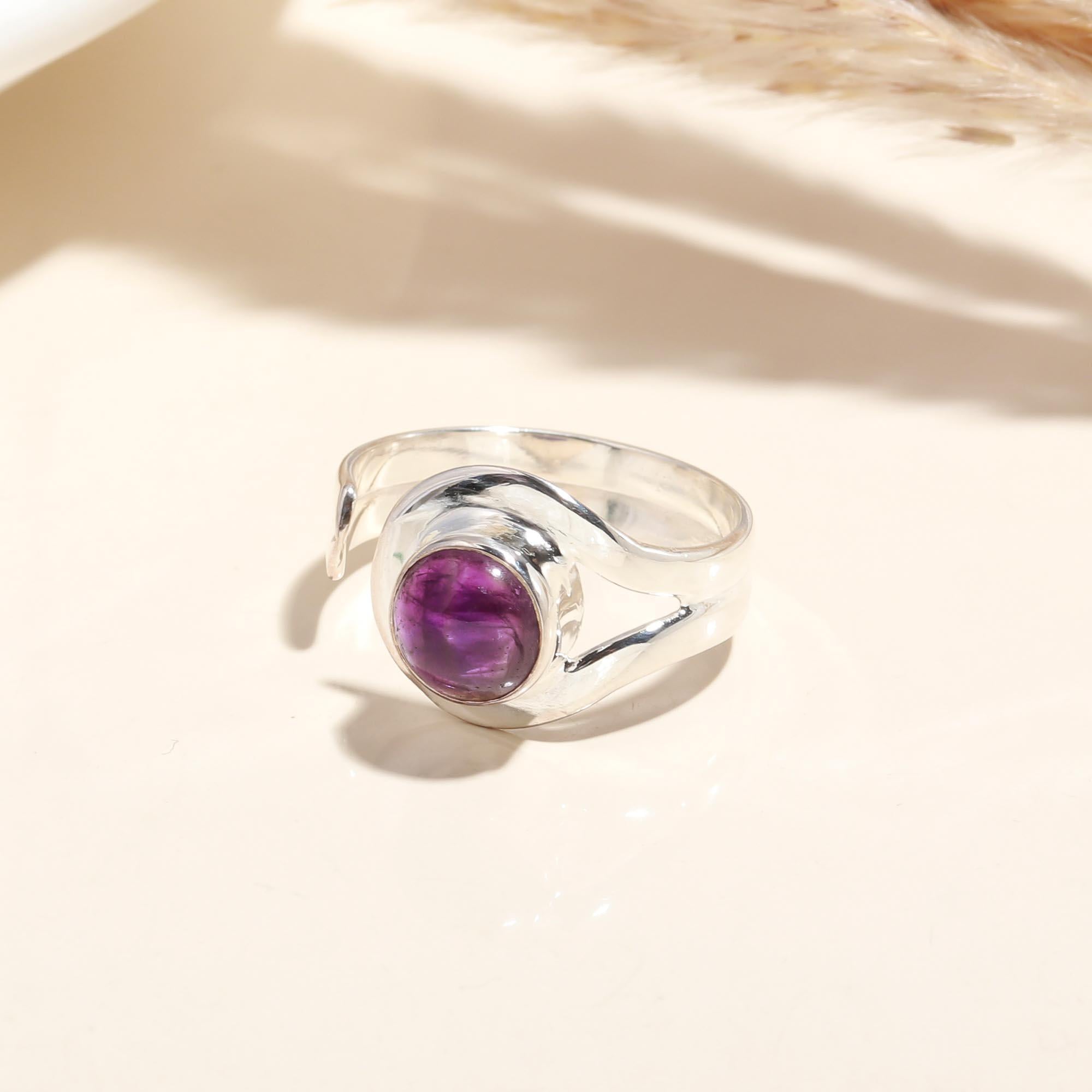 Close-up of Amethyst cabochon swirl ring