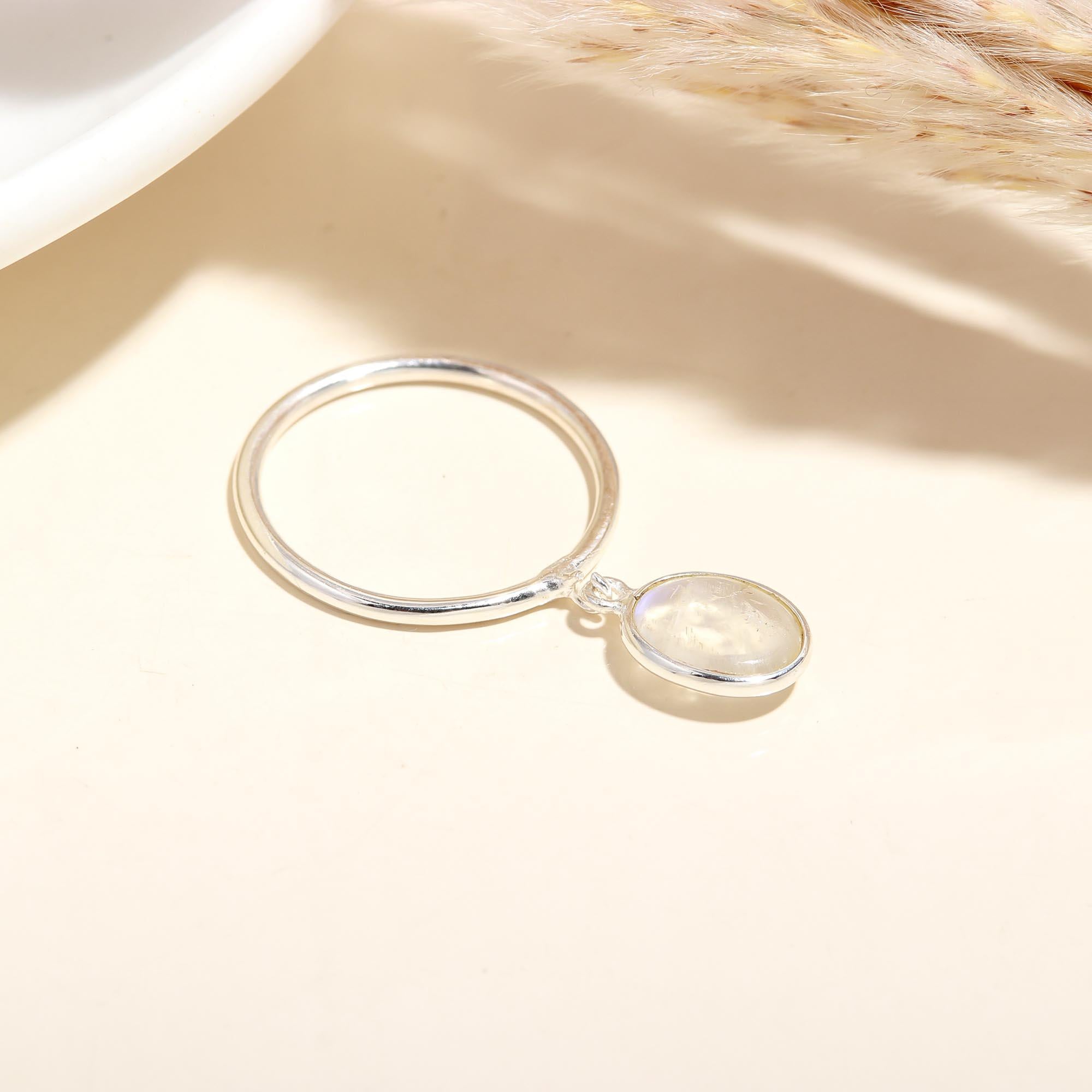 Close-up of moonstone drop silver ring
