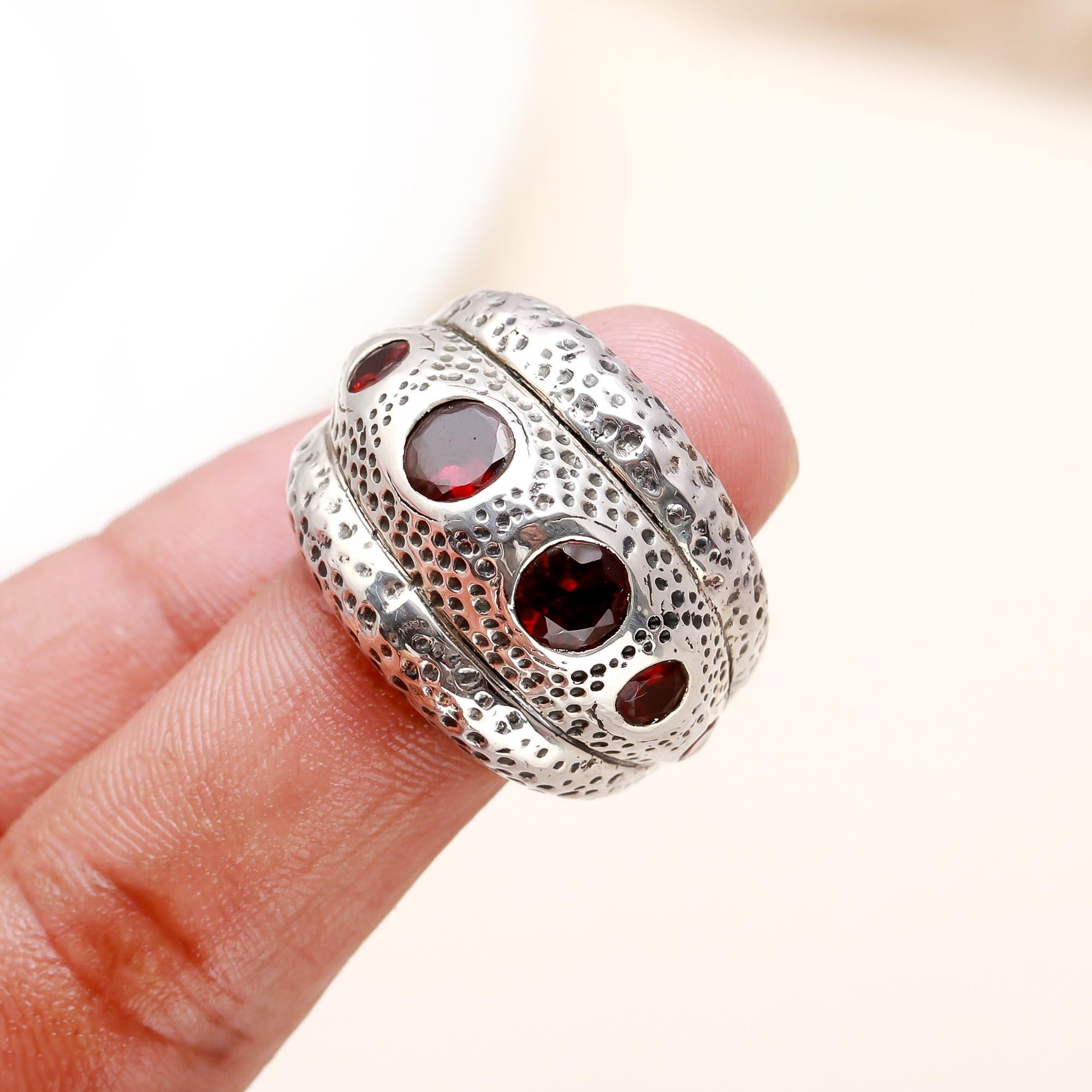 Elegant red garnet ring on finger