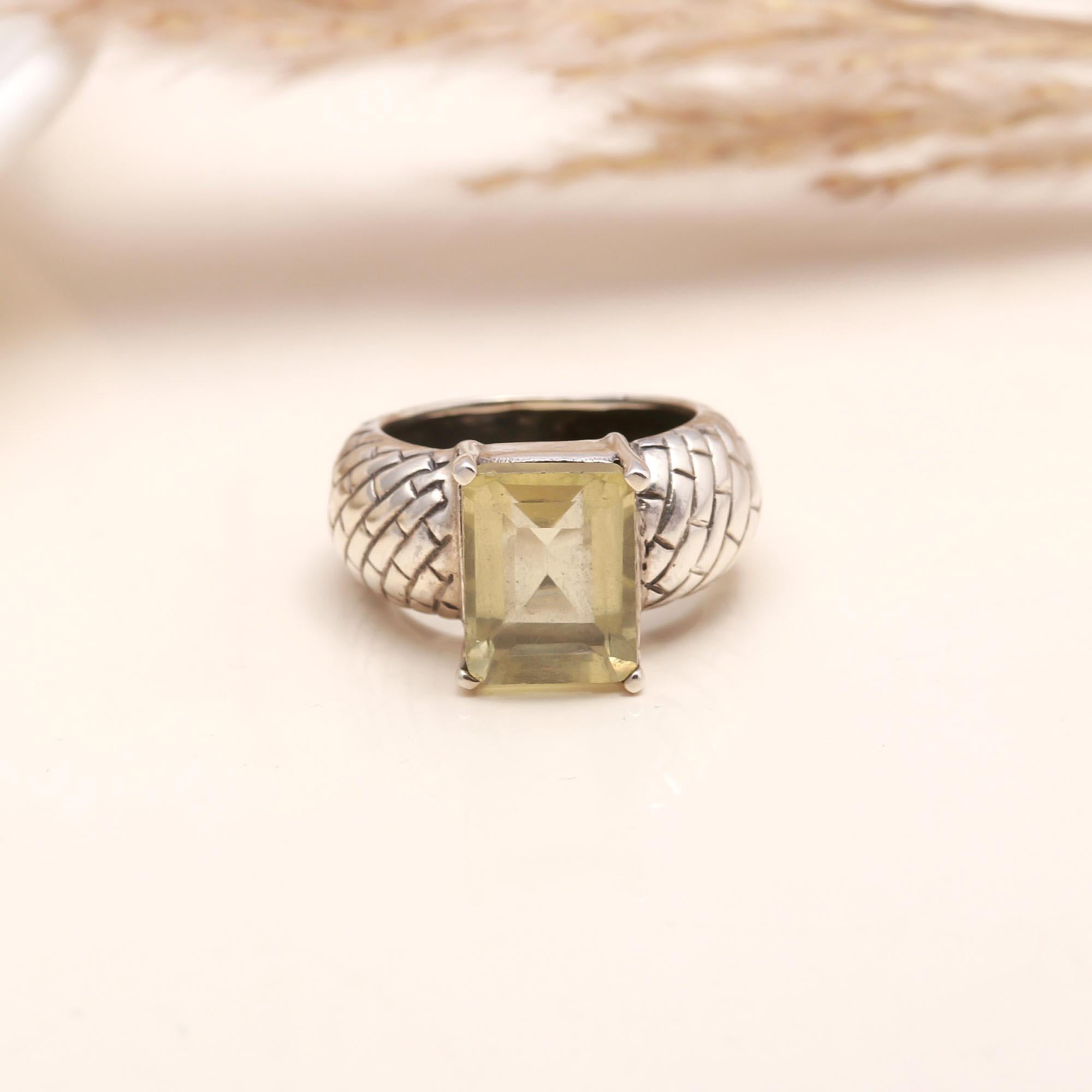 Close-up of square lemon quartz textured silver band ring