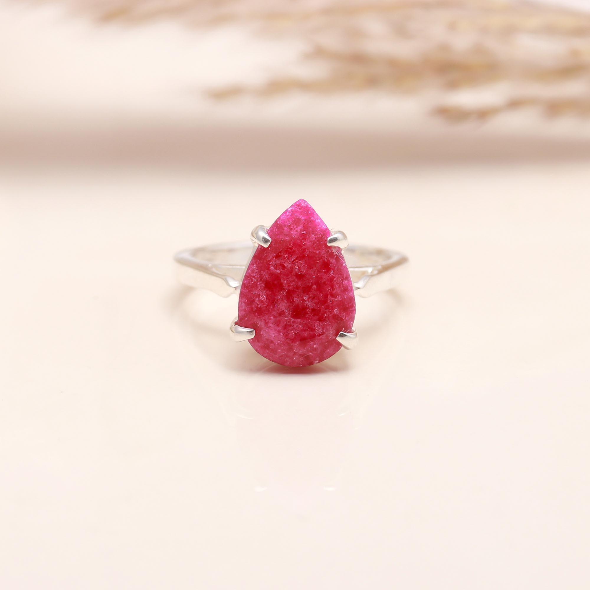 Close-up of sparkling pink druzy gemstone ring