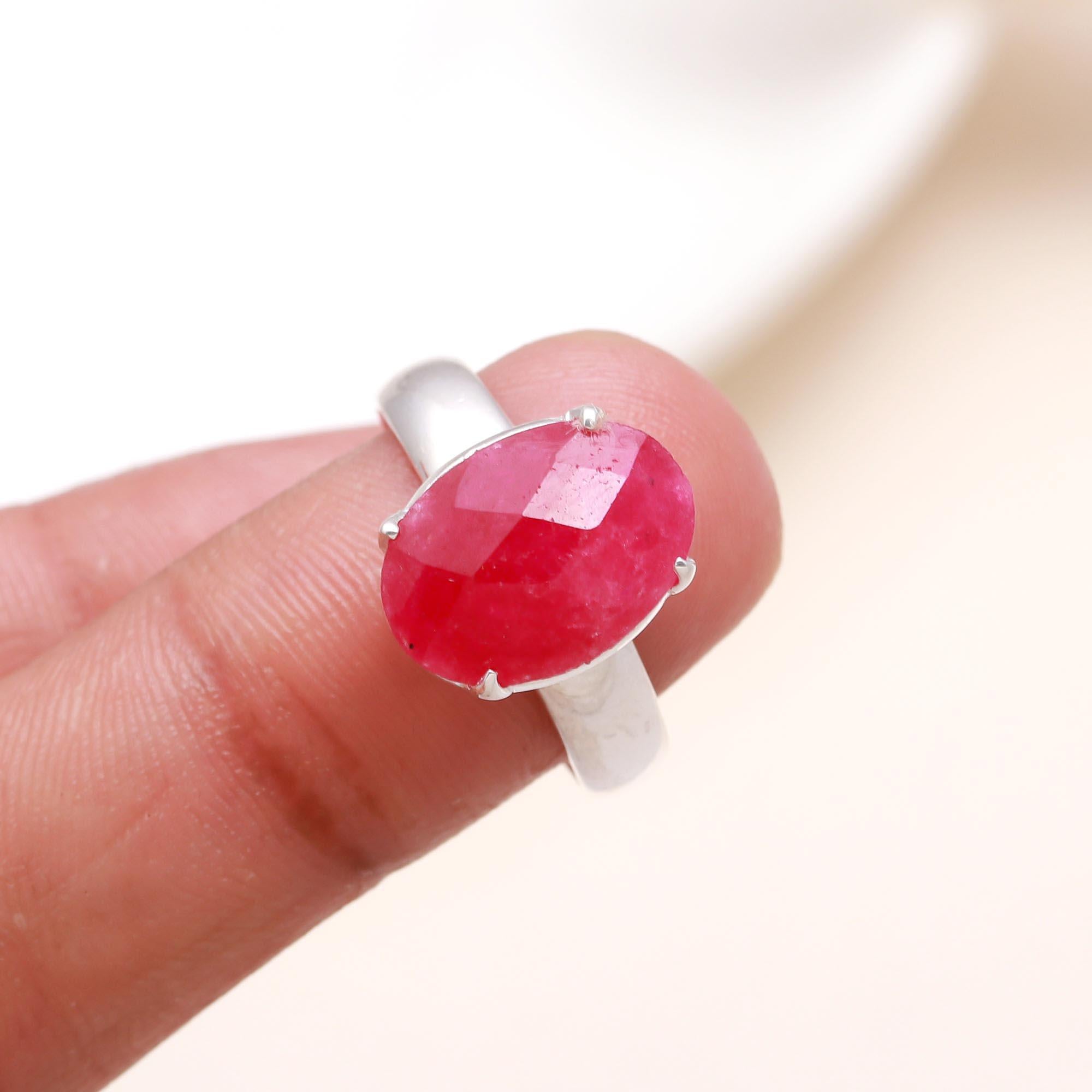 Bold ruby oval gemstone ring on finger