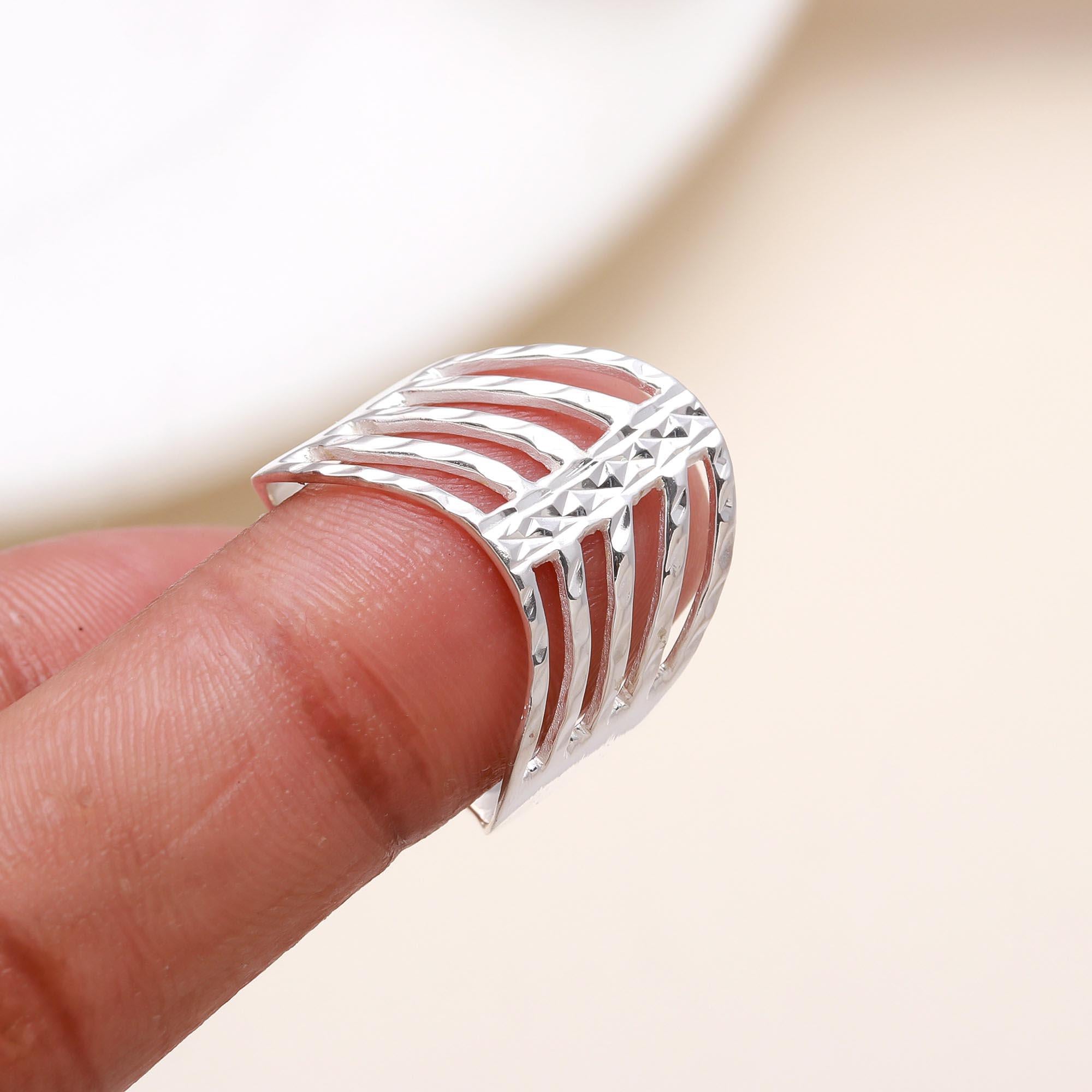 Elegant textured silver ring on finger