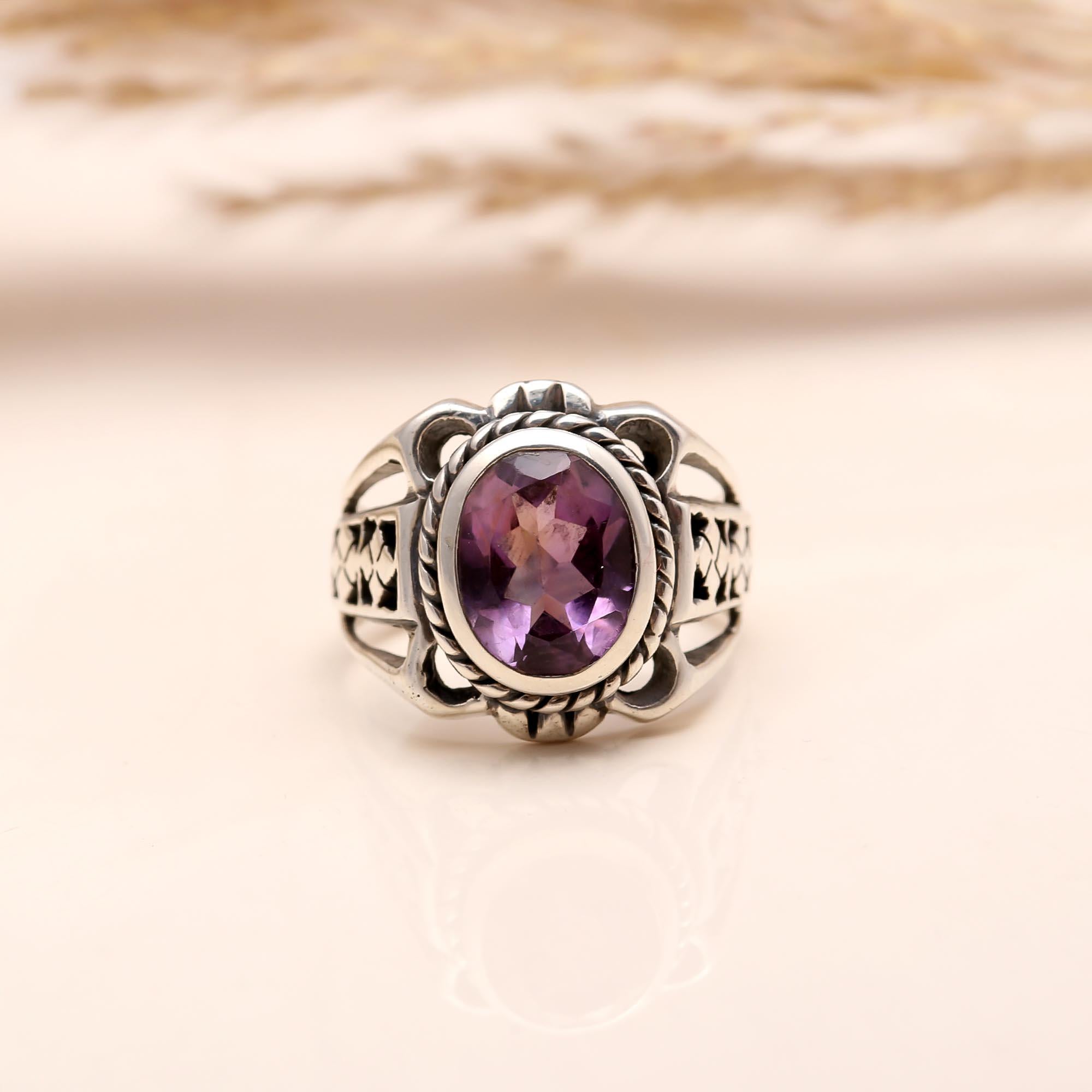 Close-up of oval amethyst boho-style silver ring