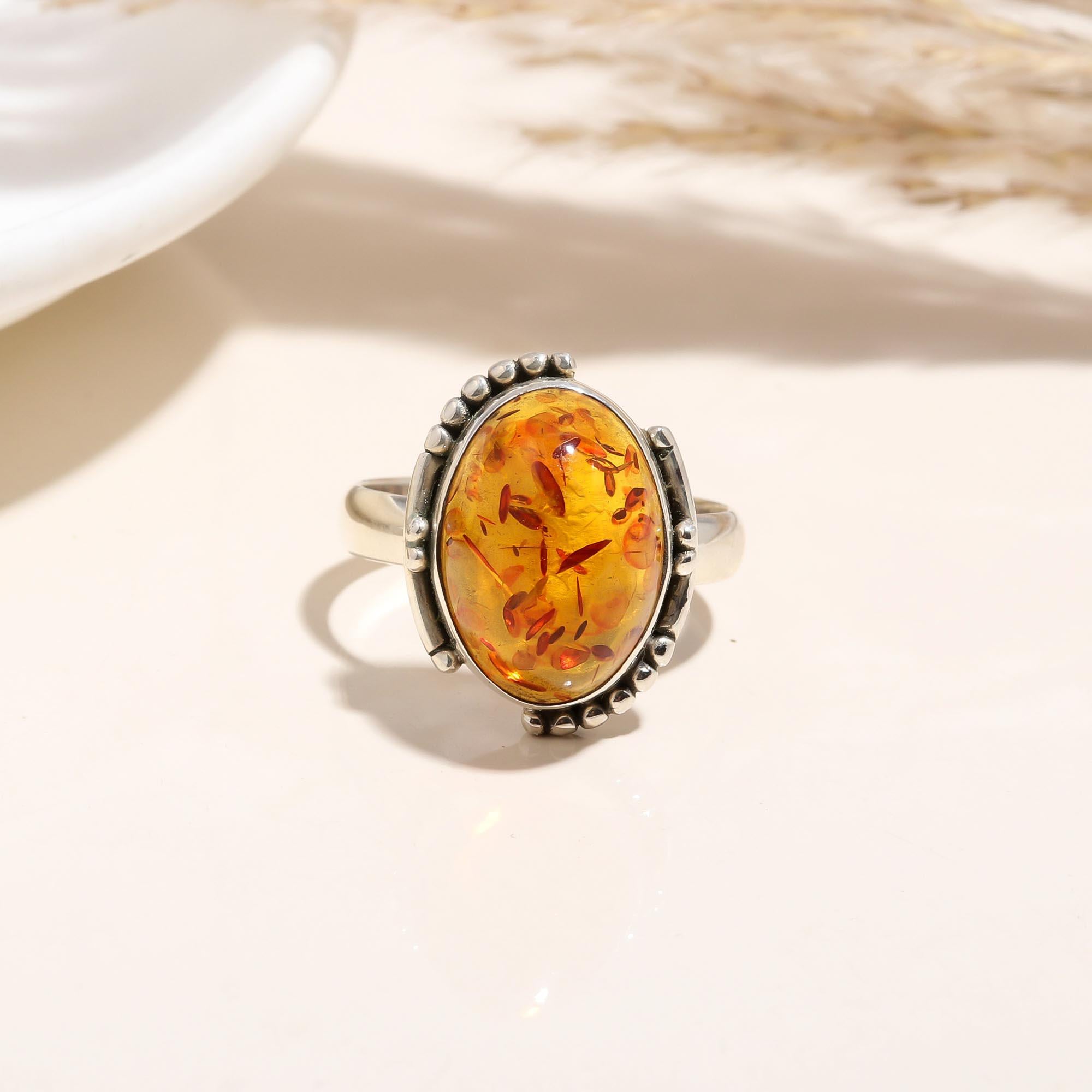 Oval Amber Ring with Beaded Silver Design