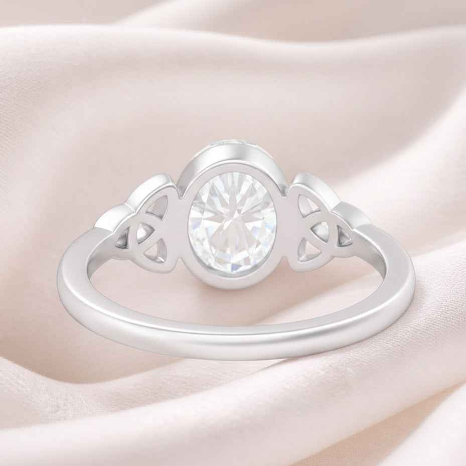 The Celtic Embrace: 1.2ct Oval Moissanite Bezel Ring