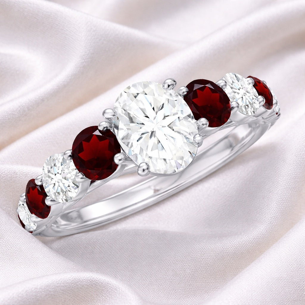 The Crimson Melody: 2.87ct Oval Moissanite & Red Accent Engagement Ring