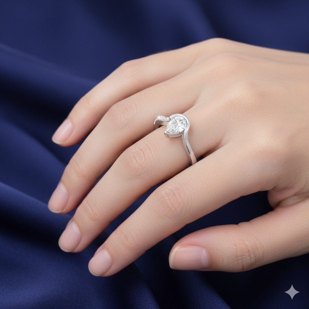 The Fluid Pear: Contemporary Bypass Moissanite Ring