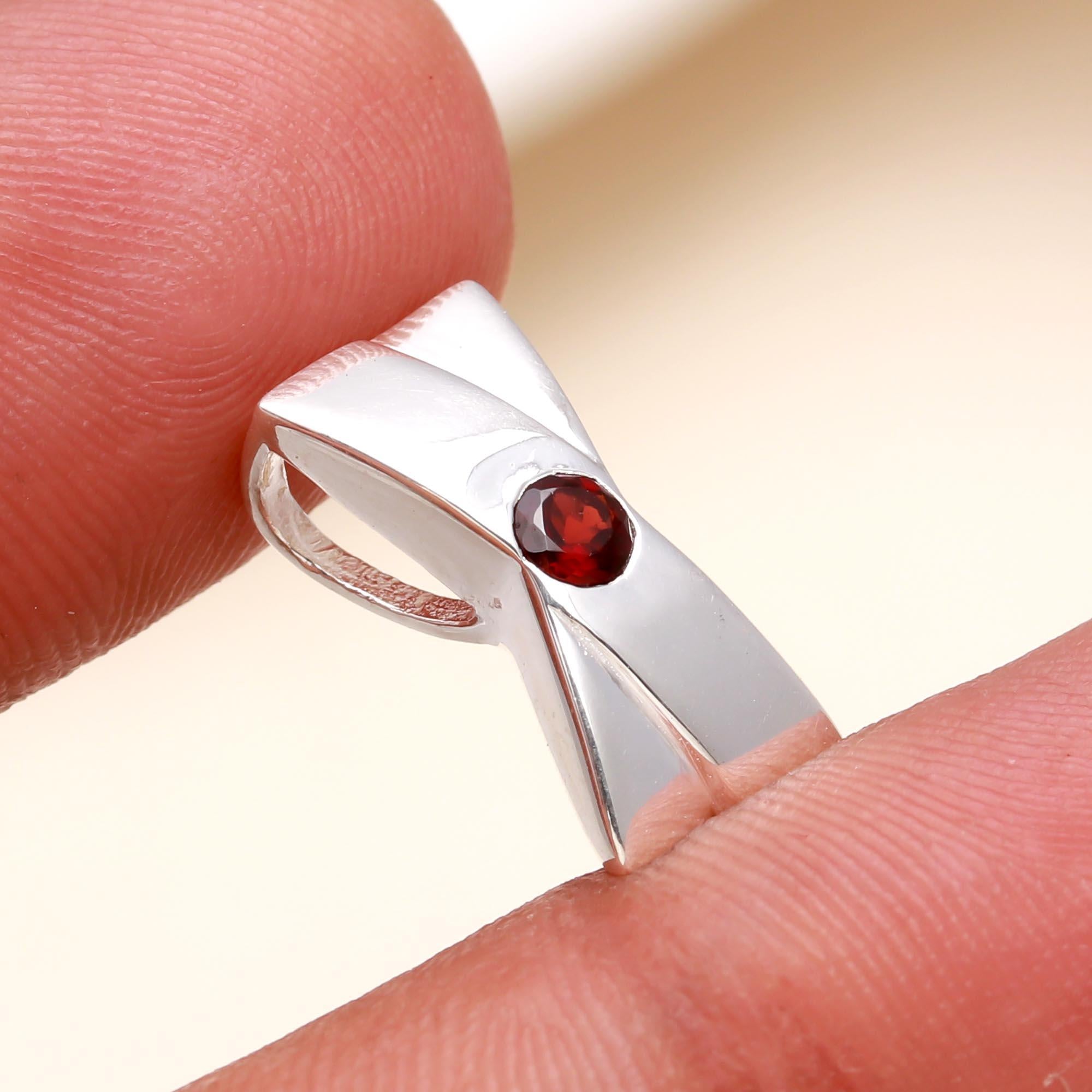 The Modern Bow: Sleek Silver Garnet Charm