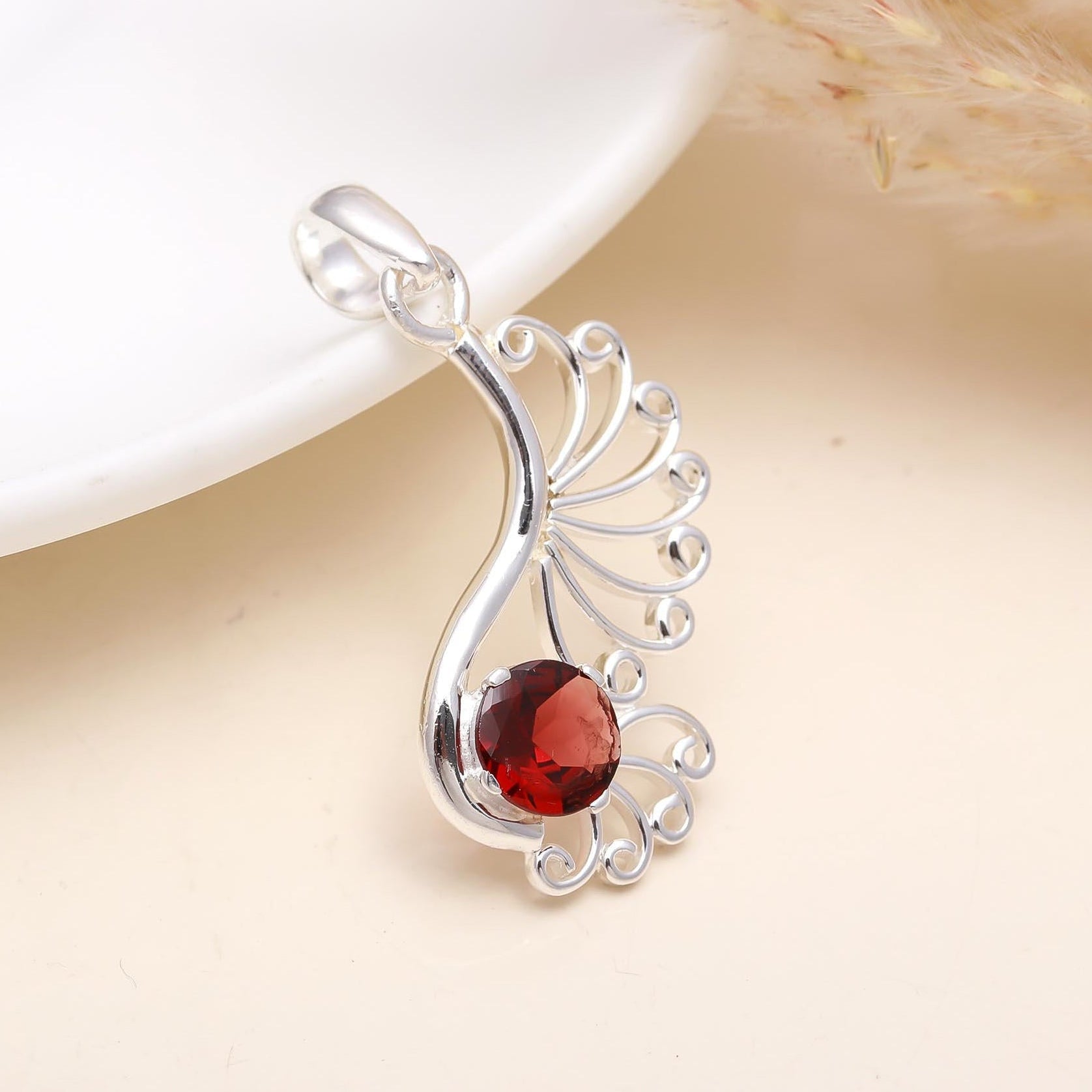 The Peacock Flame: Garnet Filigree Scroll Silver Pendant