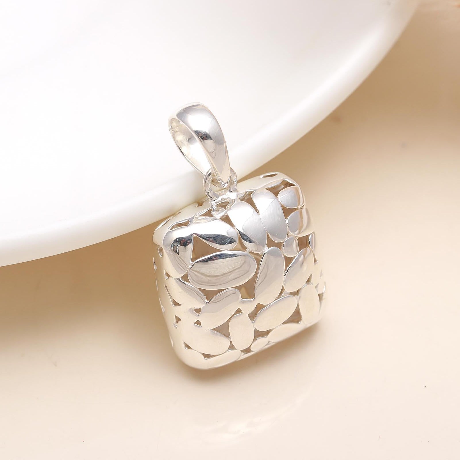 The Silver Mosaic: Abstract Cutout Pillow Pendant