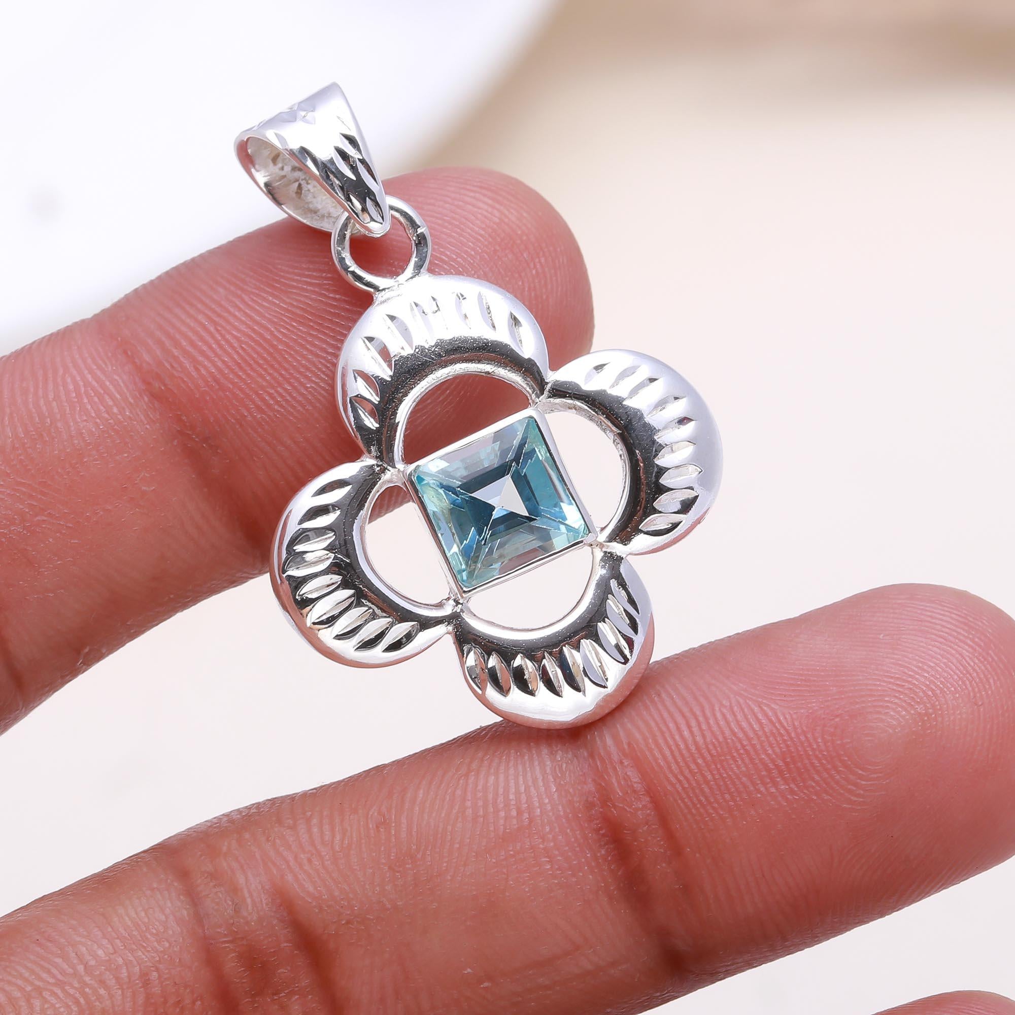 The Azure Clover: Blue Topaz Cutout Flower Pendant