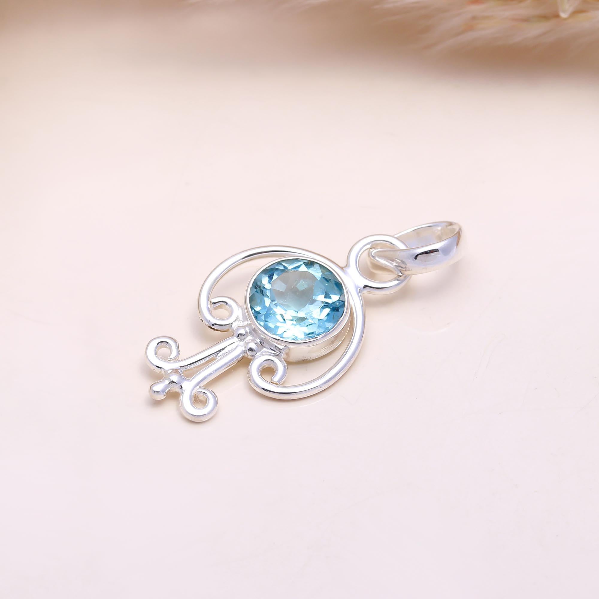 The Azure Key: Sky Blue Topaz Abstract Pendant