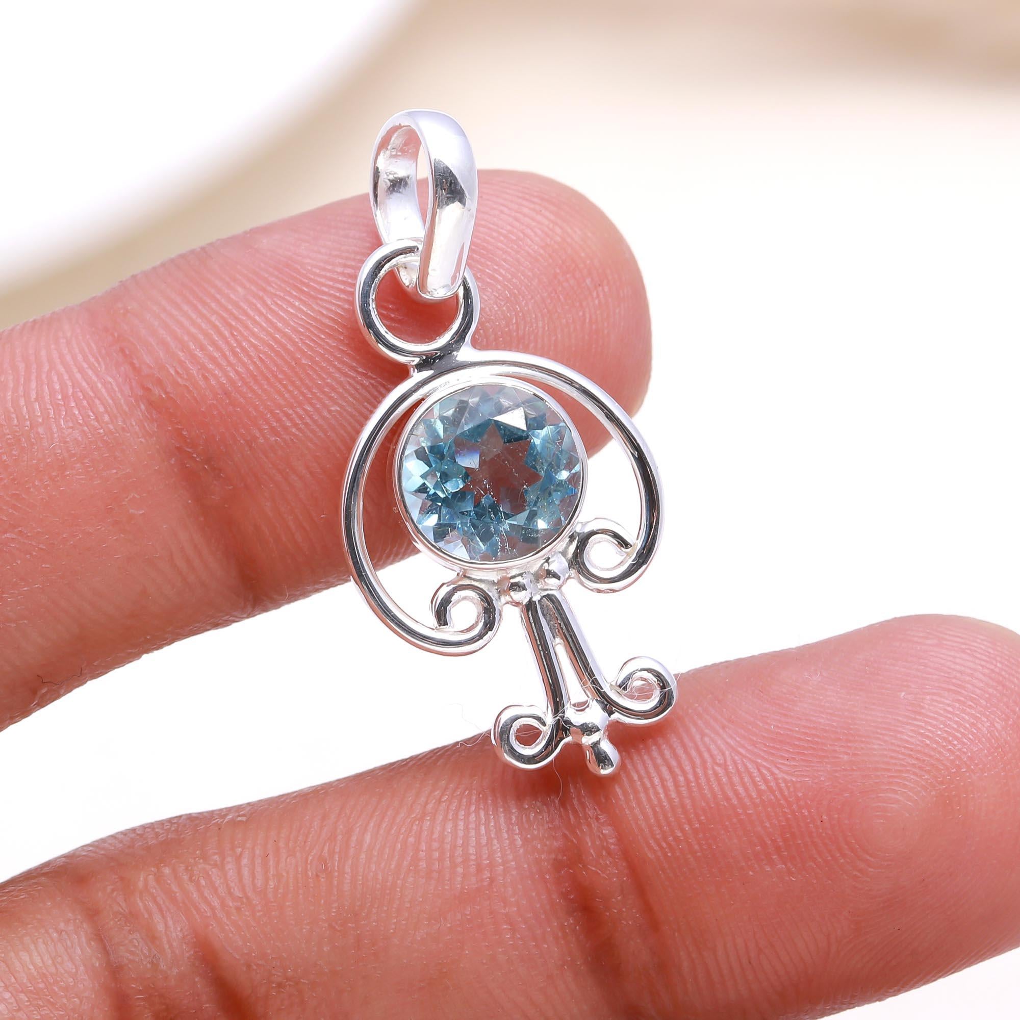 The Azure Key: Sky Blue Topaz Abstract Pendant