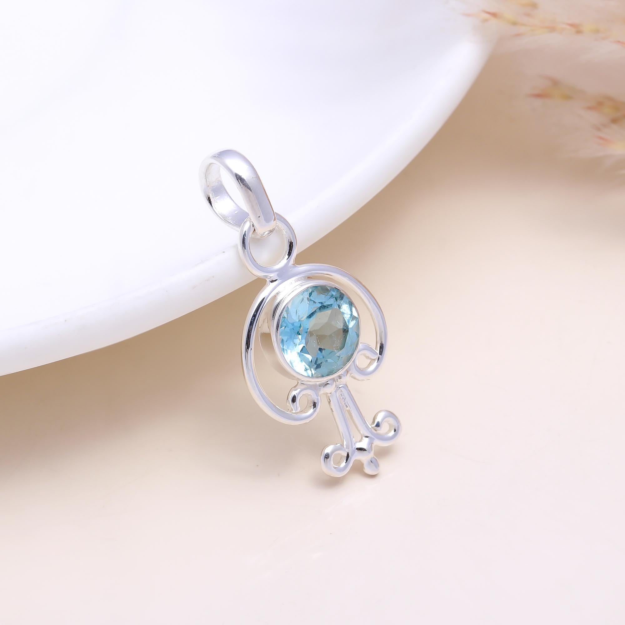 The Azure Key: Sky Blue Topaz Abstract Pendant