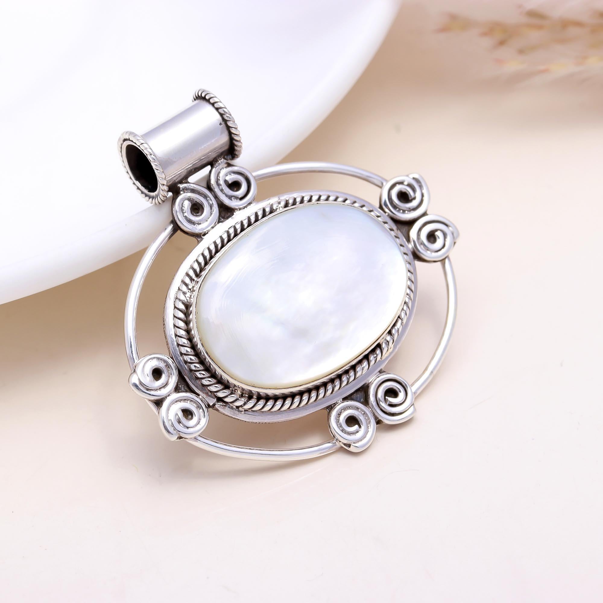The White Pearl Essence: Mother of Pearl Scrollwork Pendant