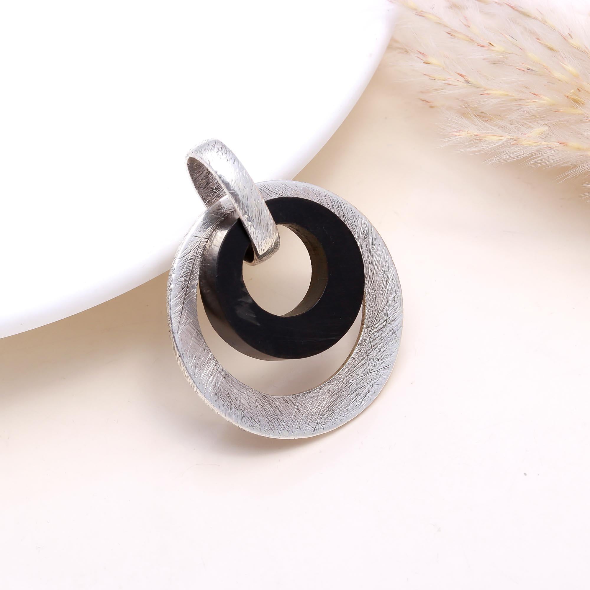 The Modern Halo Title: Silver & Black Wood Geometric Pendant