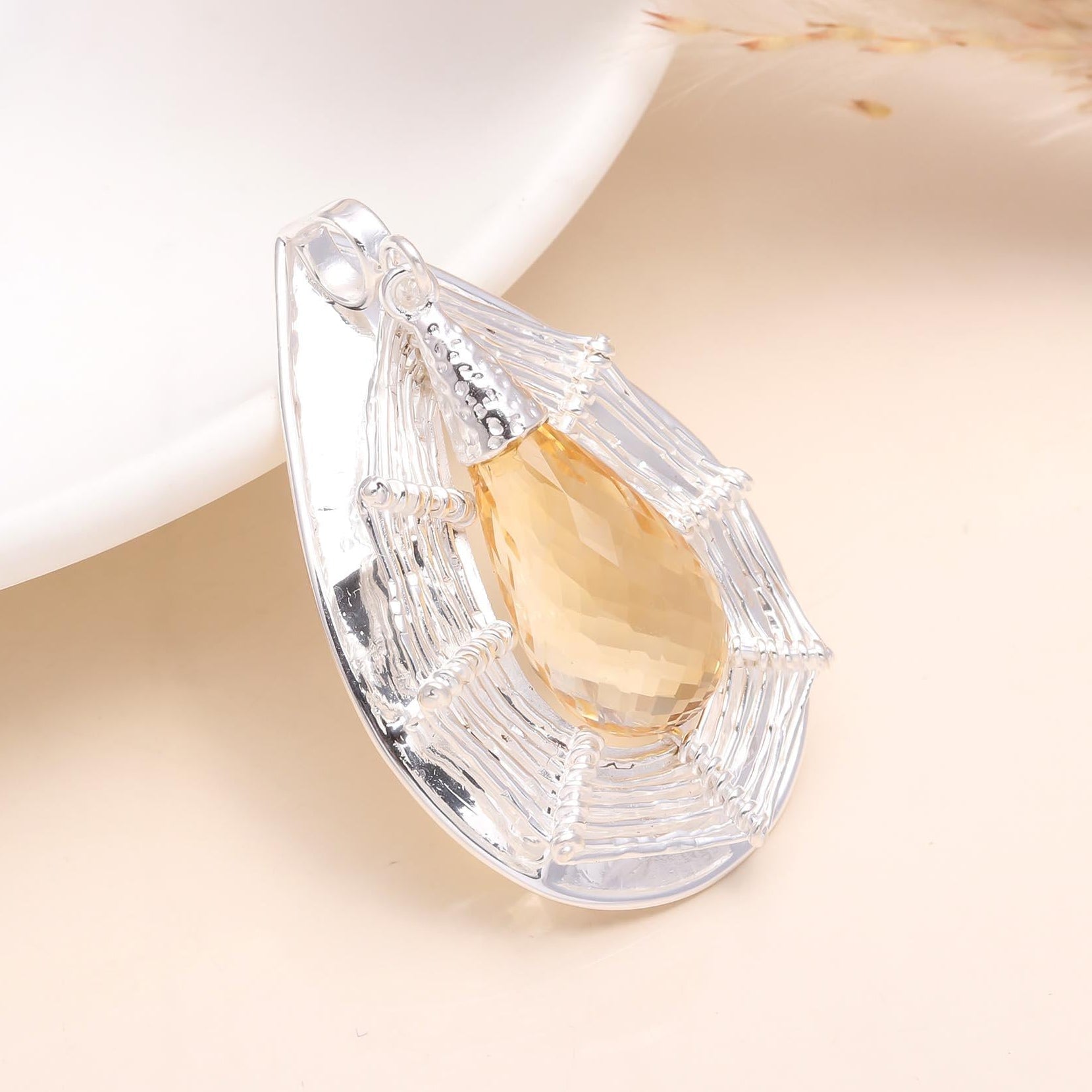 925 Sterling Silver Teardrop Citrine Pendant with a teardrop-shaped citrine gemstone set in a silver mounting, displayed against a light background.