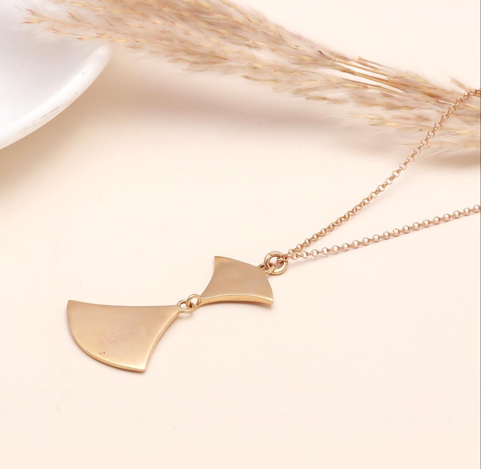 The Modern Wing: Geometric Gold Abstract Necklace
