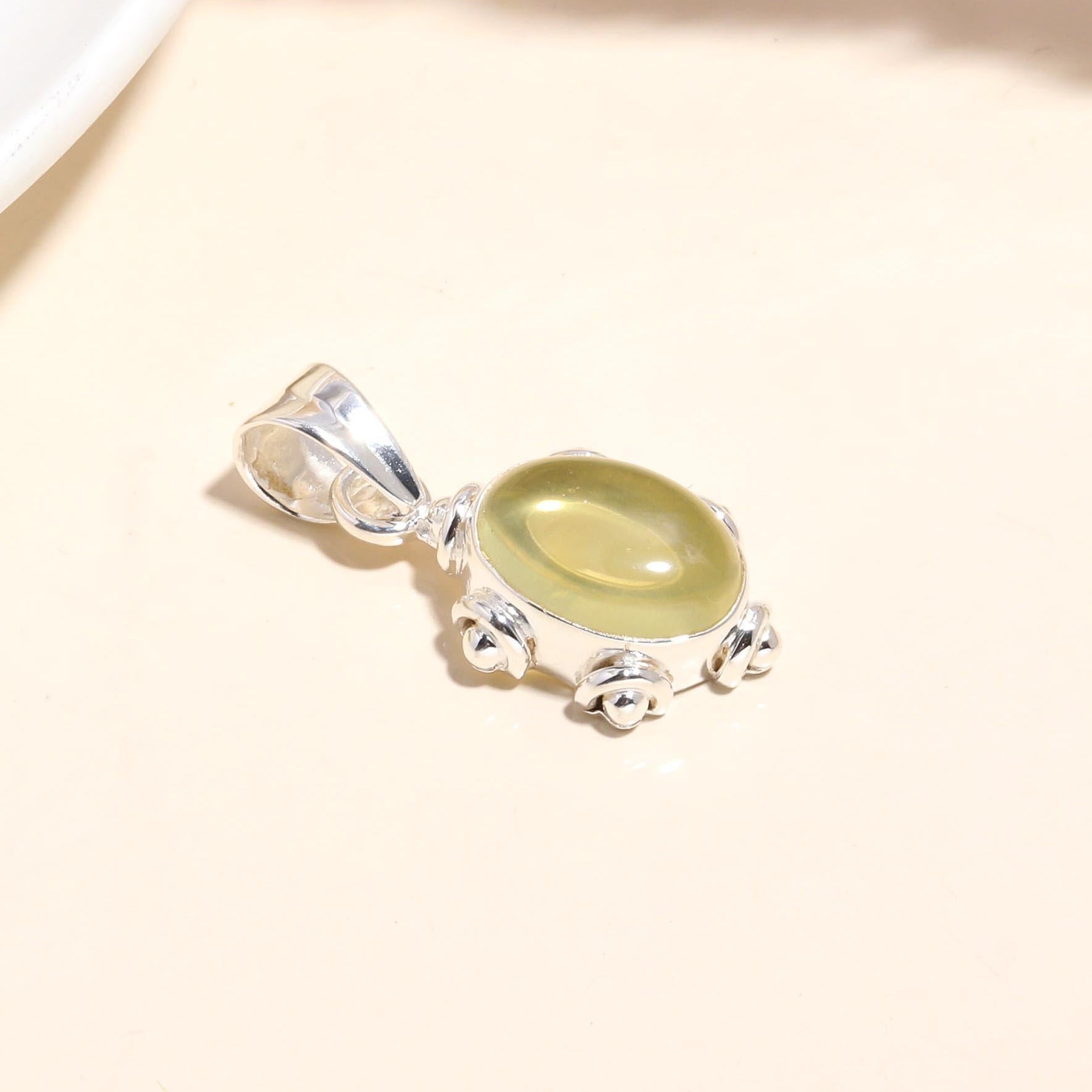 The Solar Pebble: Minimalist Studded Oval Charm