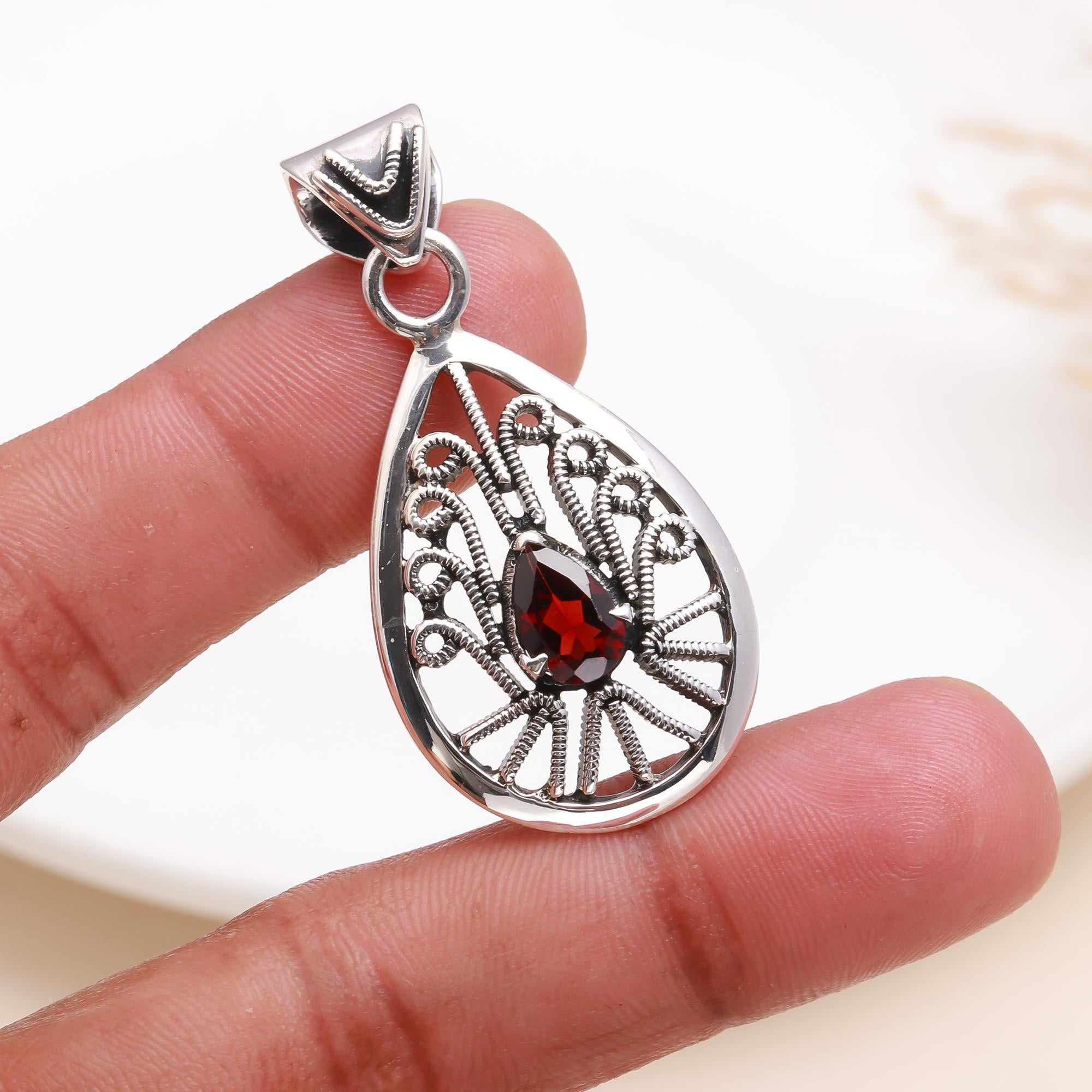 The Peacock Teardrop: Garnet Filigree Silver Pendant